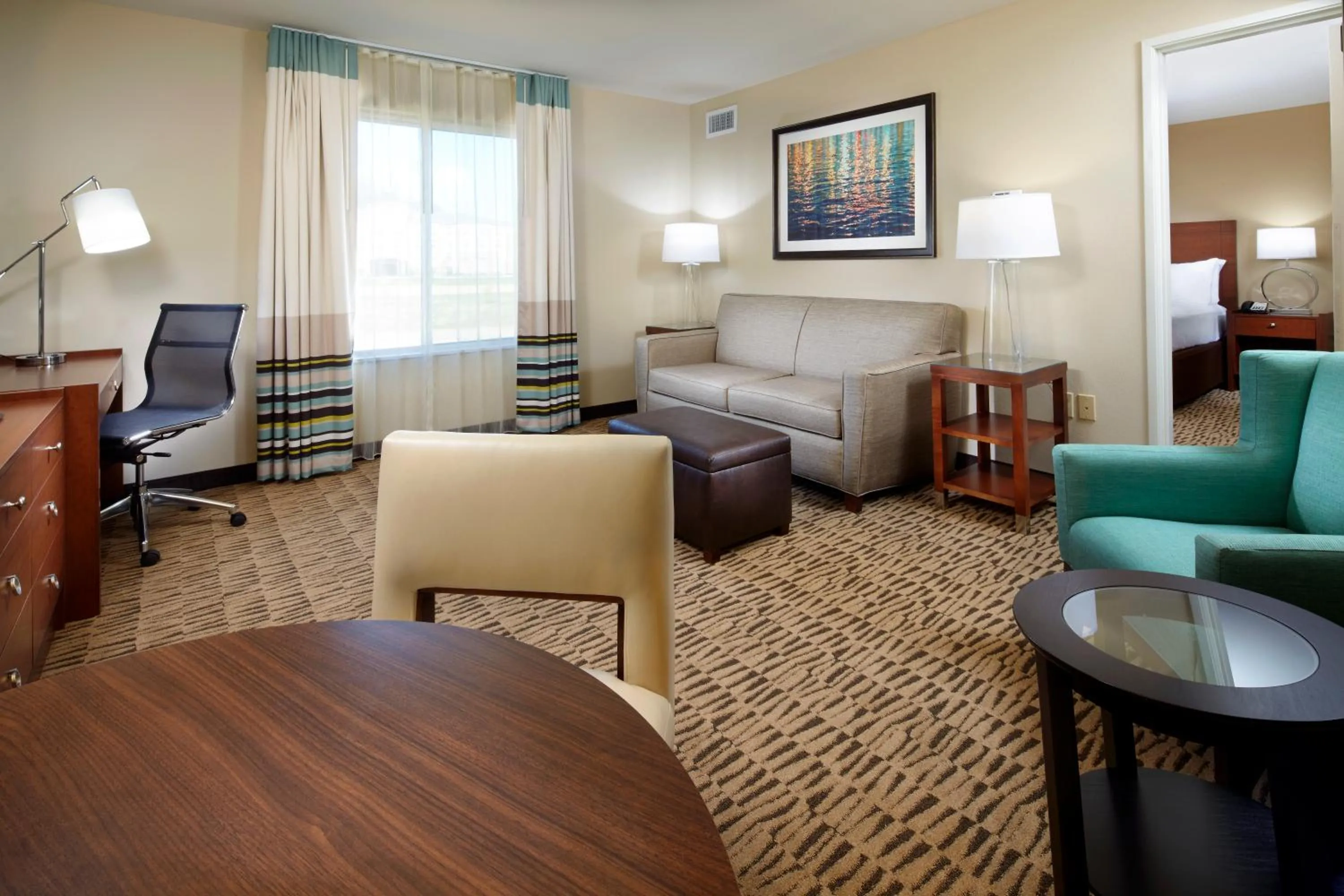 Living room, Bed in Hawthorn Suites by Wyndham Wheeling at The Highlands