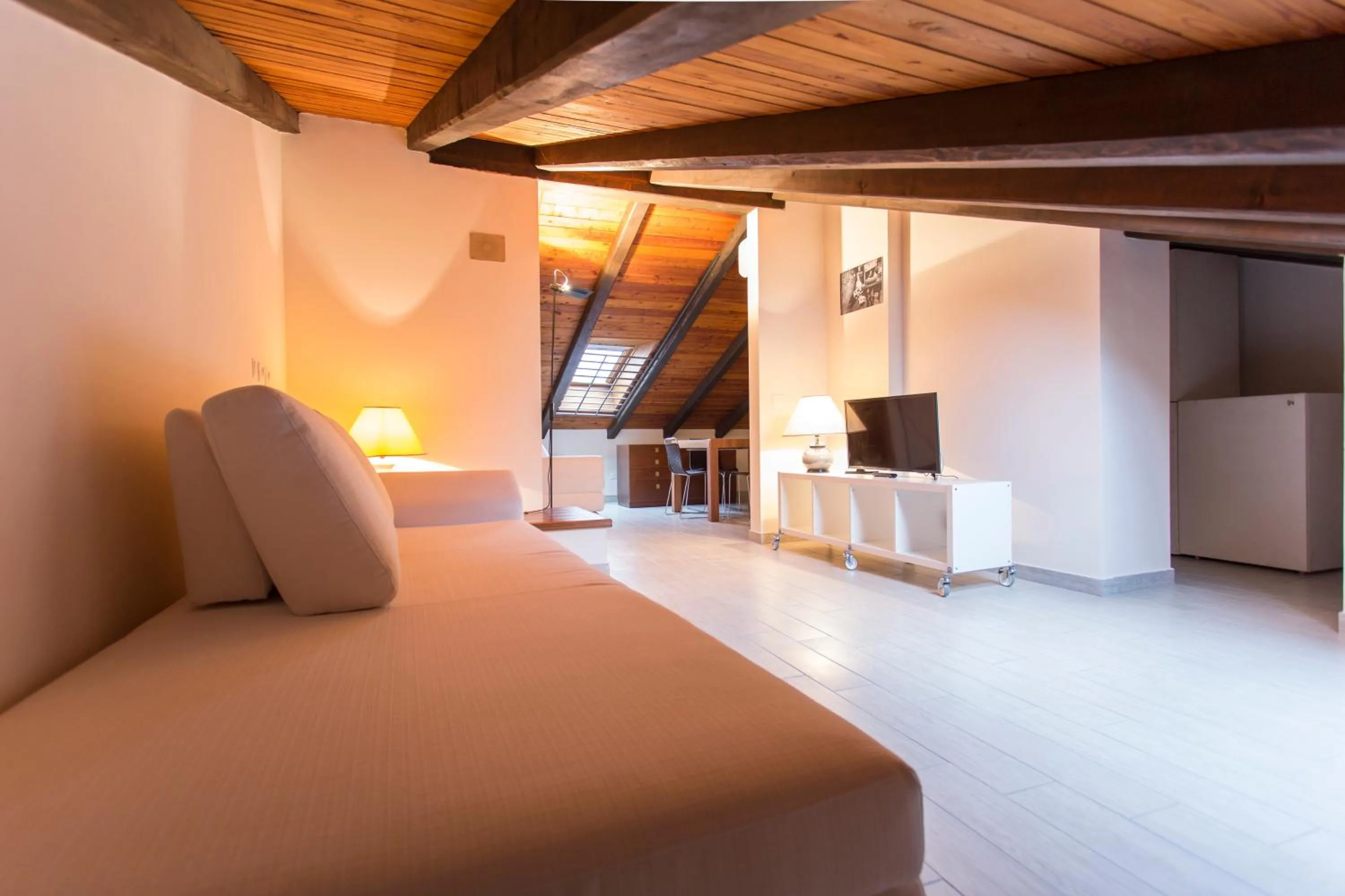 Living room, Bed in Residenza Ariosto Depandance by Studio Vita