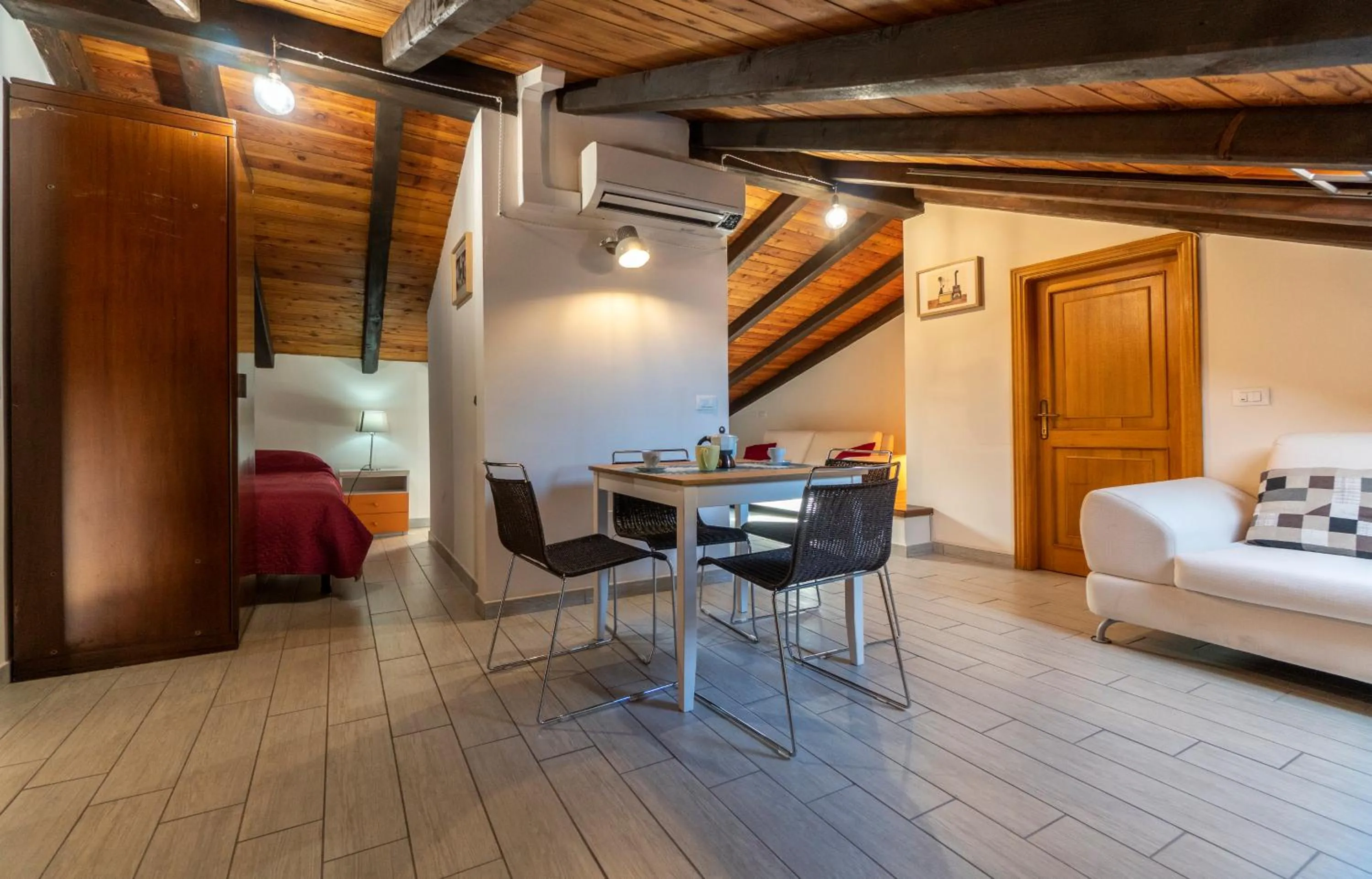 Seating area, Bed in Residenza Ariosto Depandance by Studio Vita