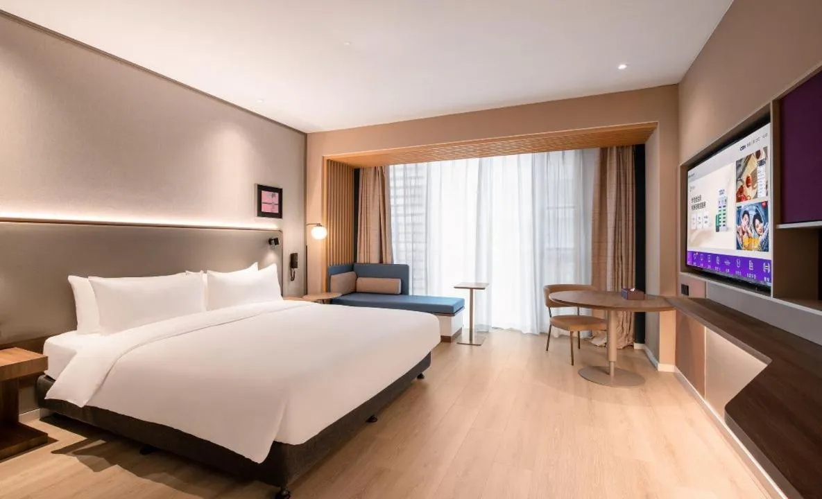 Bed in Mecure Hotel Nantong Central Business District