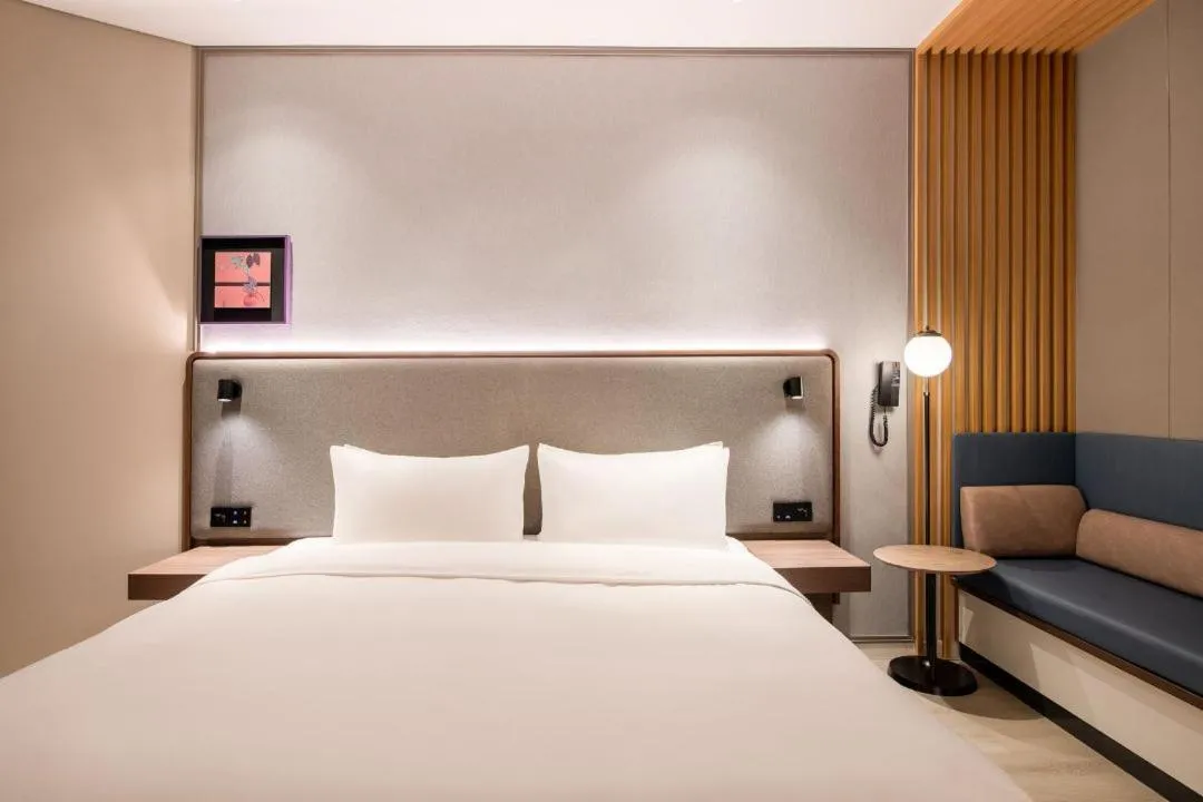 Bed in Mecure Hotel Nantong Central Business District