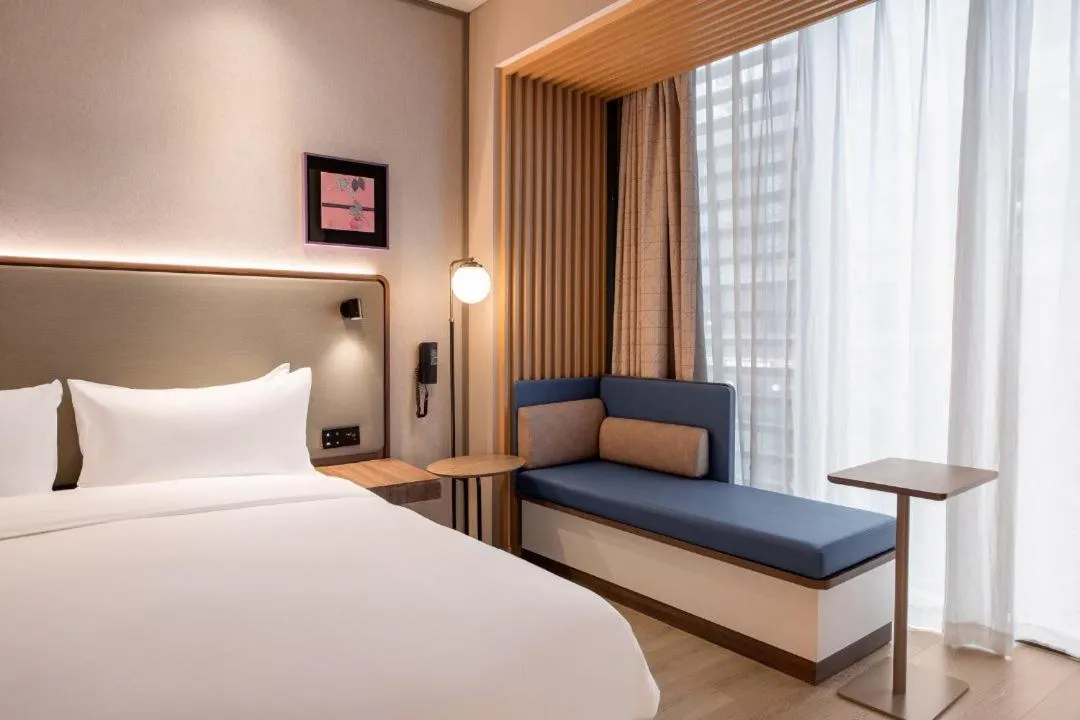 Bed in Mecure Hotel Nantong Central Business District