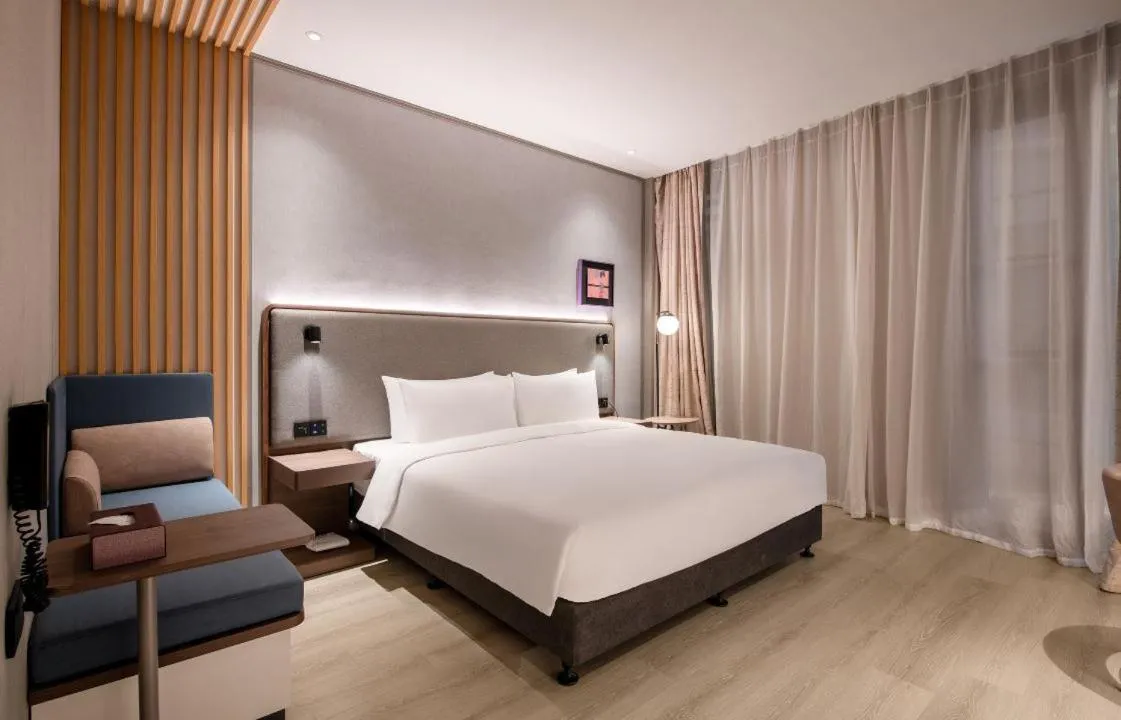Bed in Mecure Hotel Nantong Central Business District