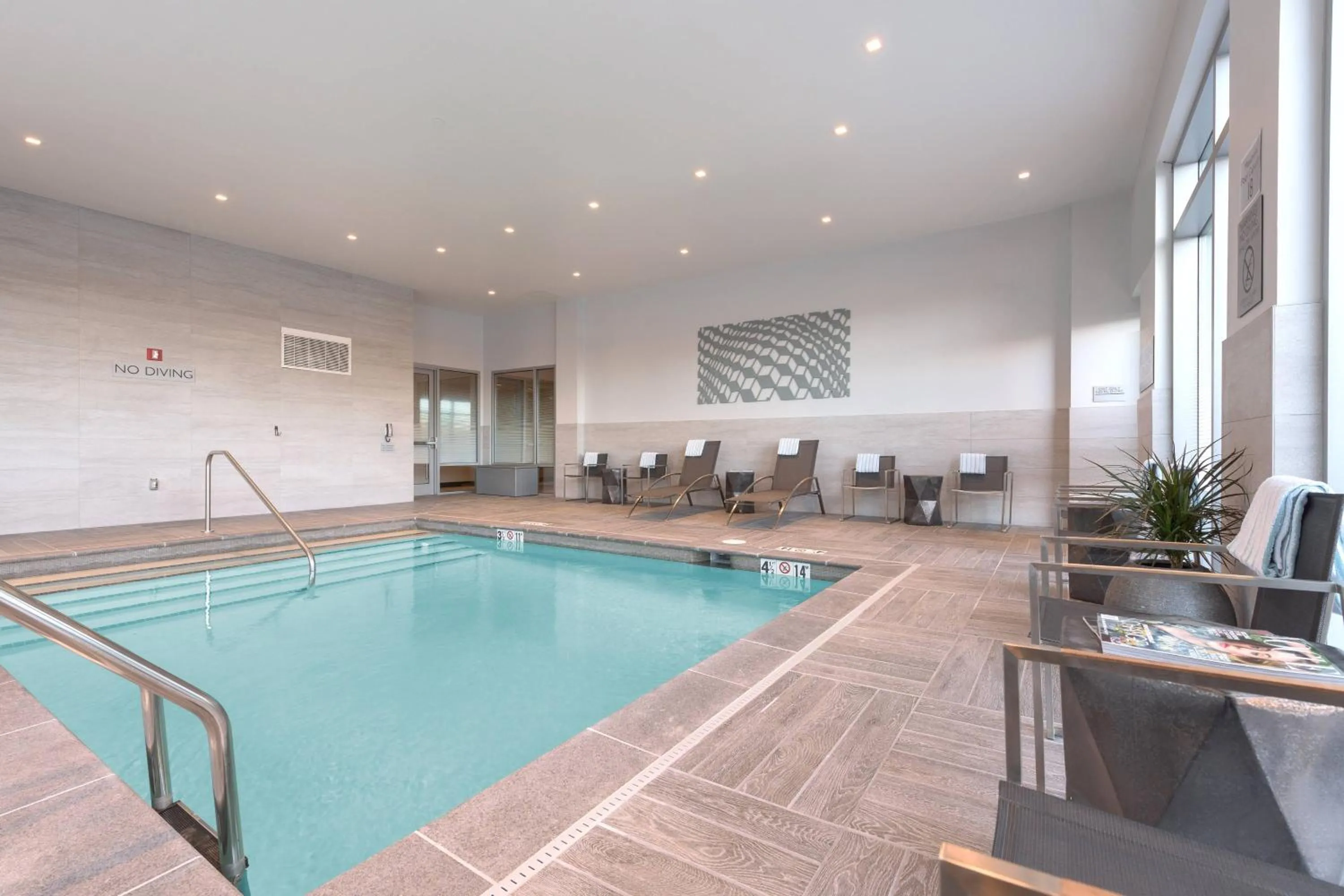 Swimming pool in AC Hotel by Marriott Boston North