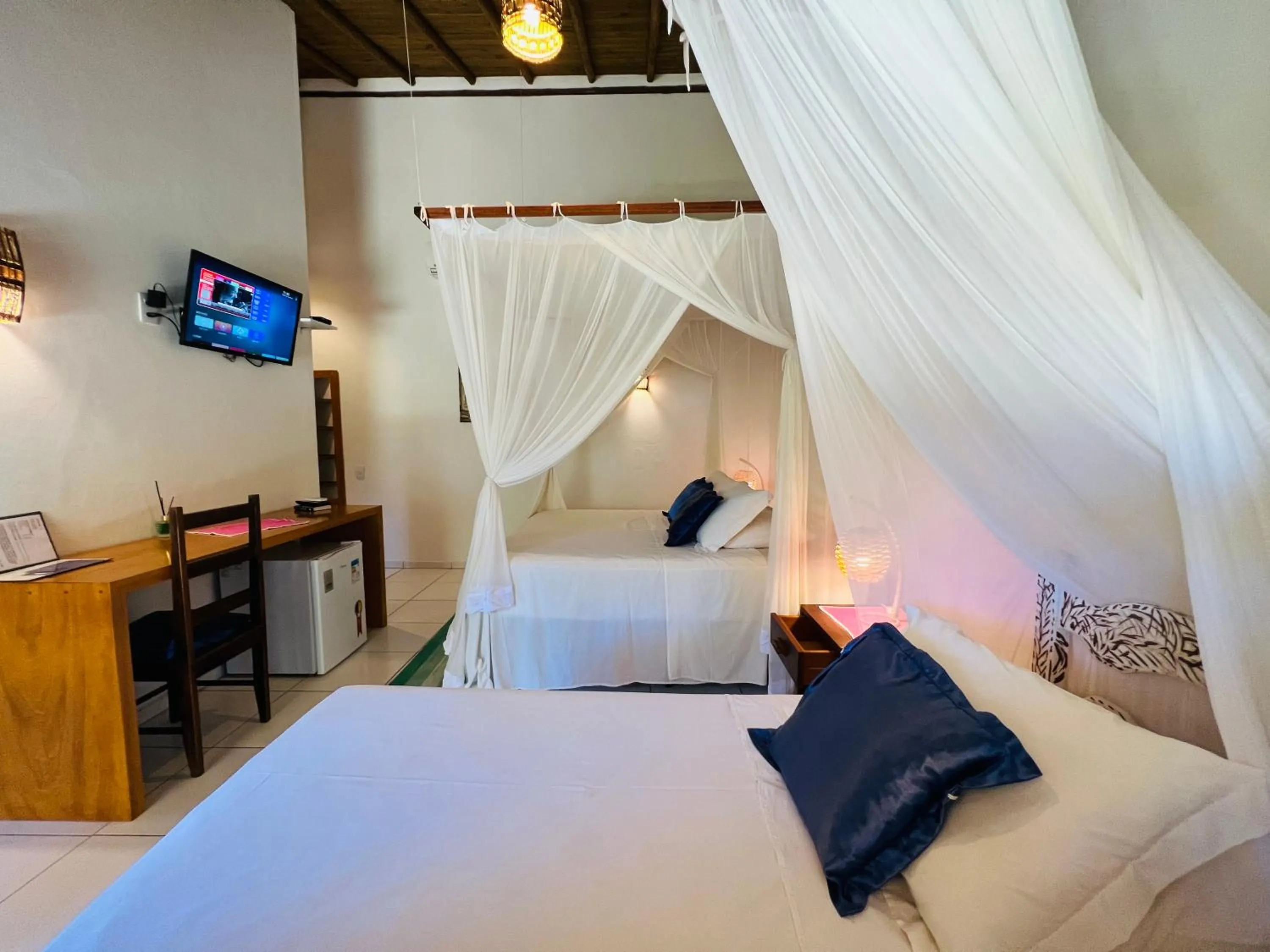 Bed in Pousada Pandoro