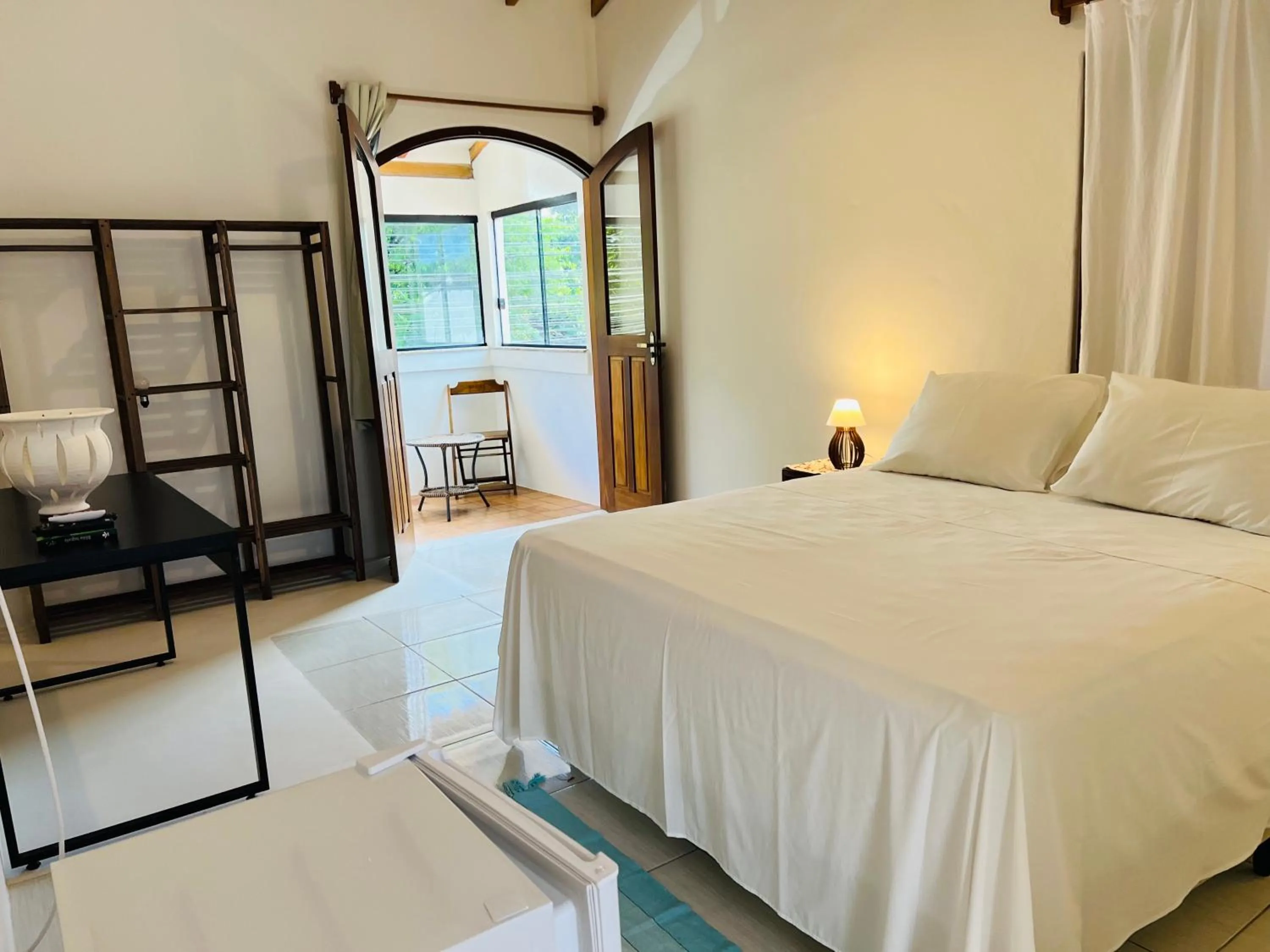 Photo of the whole room, Bed in Pousada Pandoro