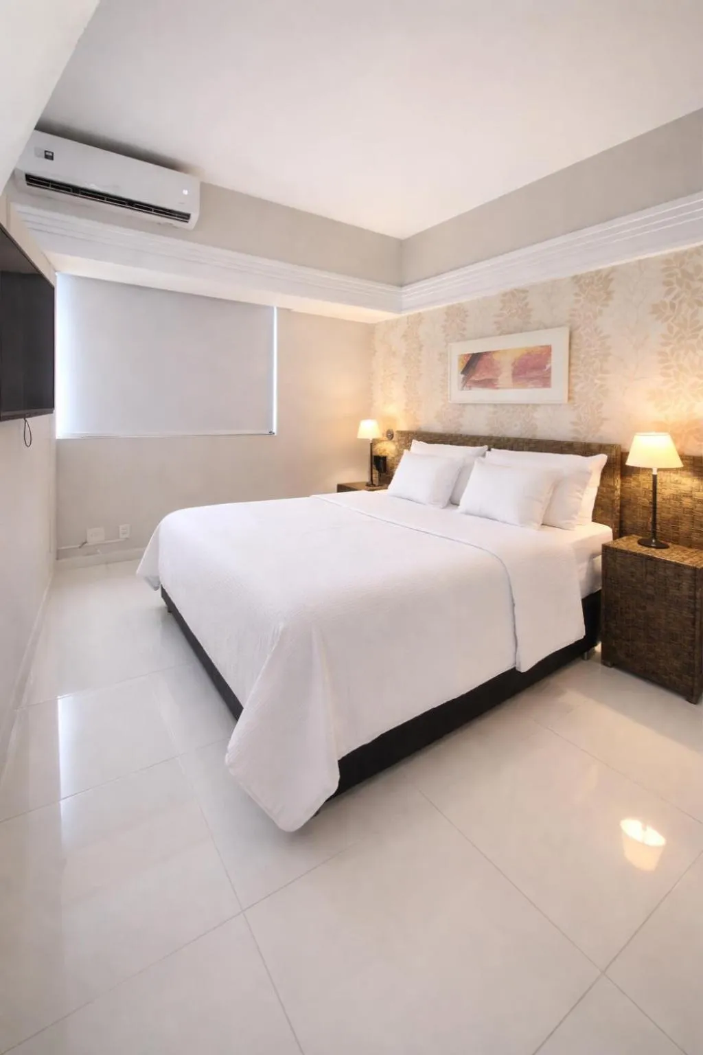 Bed in Tropical Executive Hotel