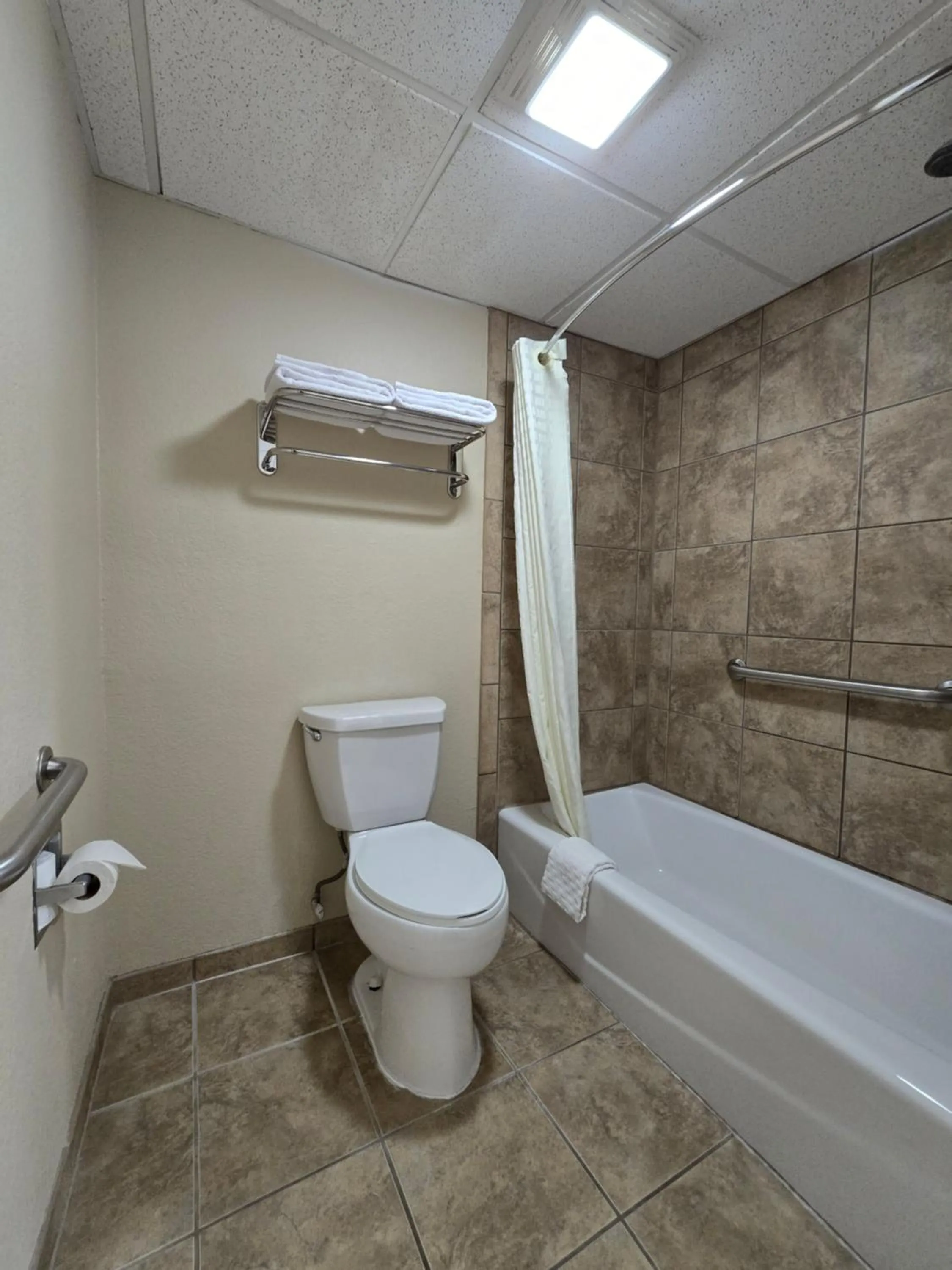 Toilet in Baymont by Wyndham McAlester Hwy 69