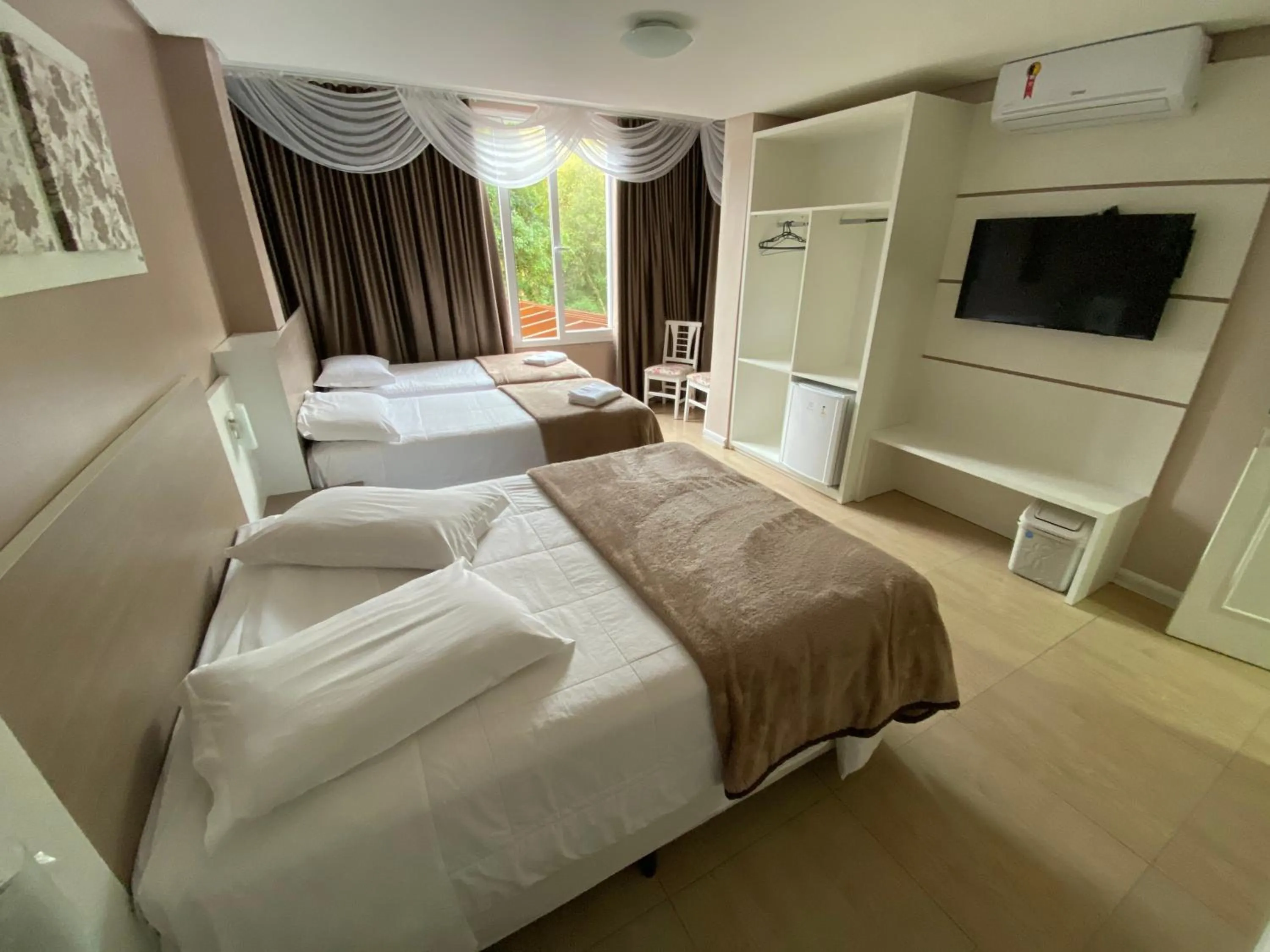 Bed in Pousada Vovô Nino