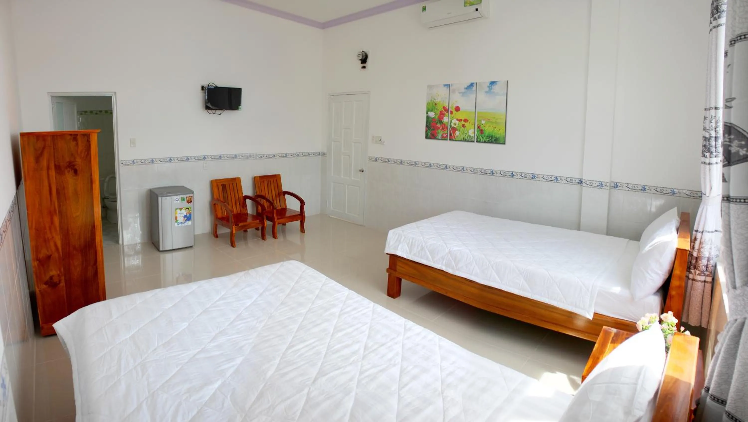 Bed in Hung Phuc Mui Ne Hotel