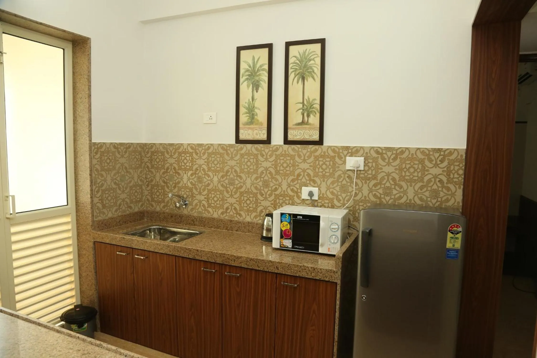 Kitchen or kitchenette in La Vida Studio Inn Baga- Goa- By Lords Hotels and Resorts
