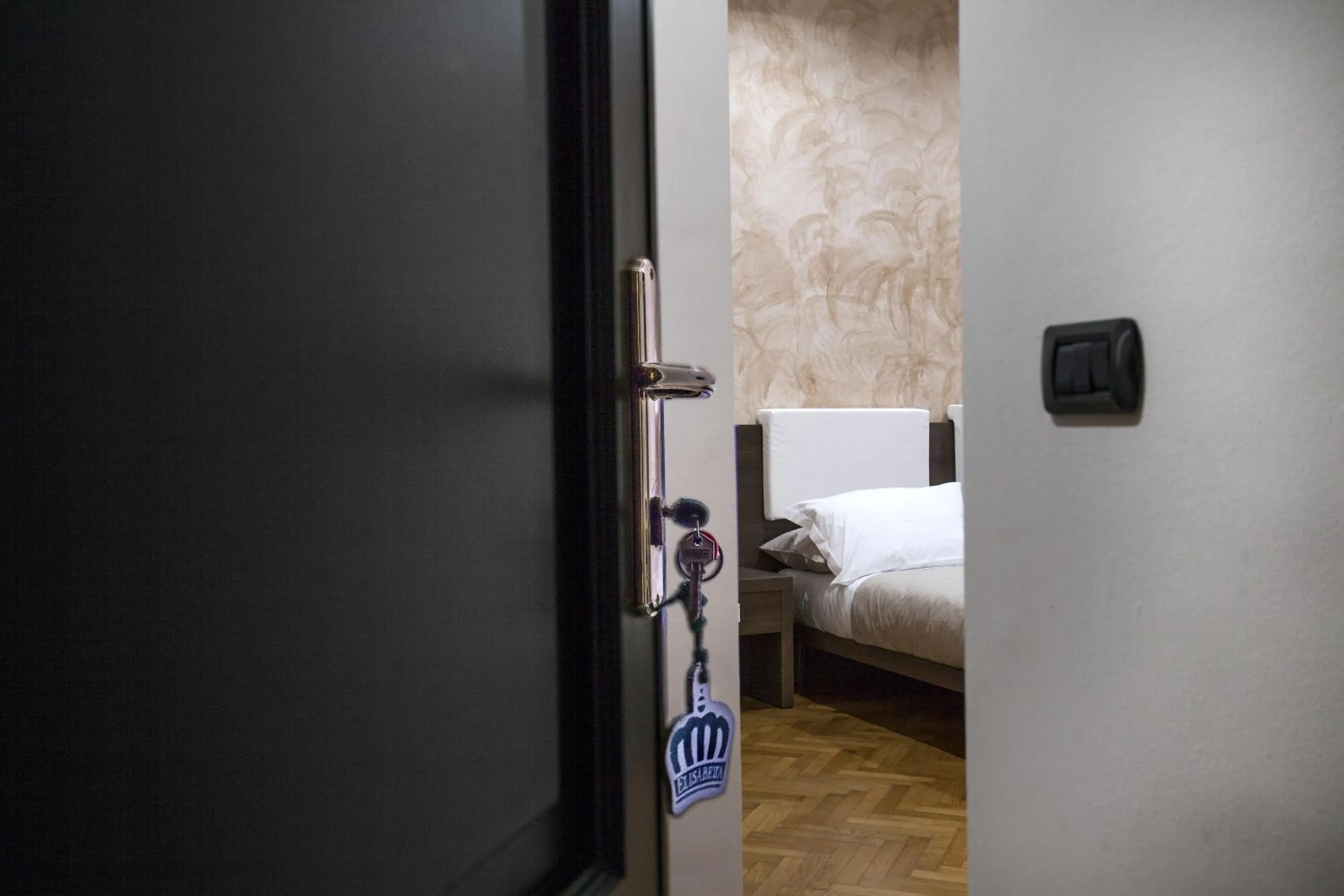 Decorative detail, Bed in VITTORIA ROOMS GuestHouse - the Original since 2015