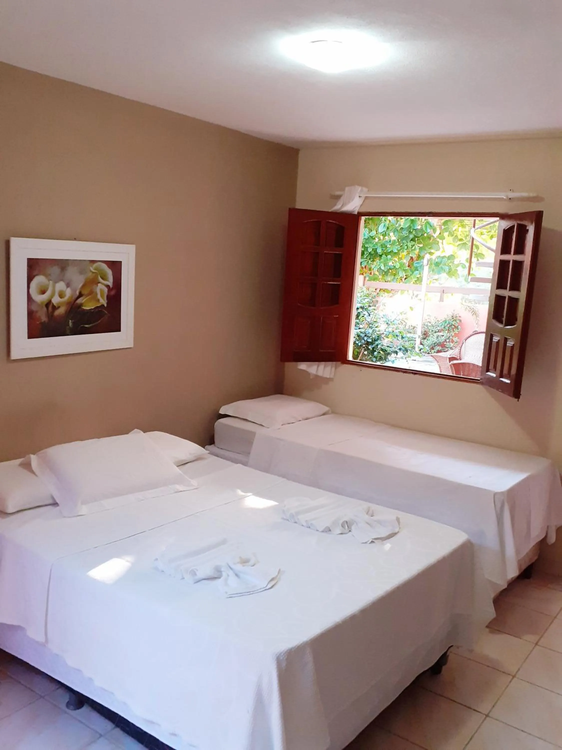 Bed in Pousada Rota Beach