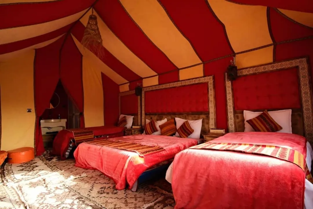 Bed in Merzouga Luxury Camp