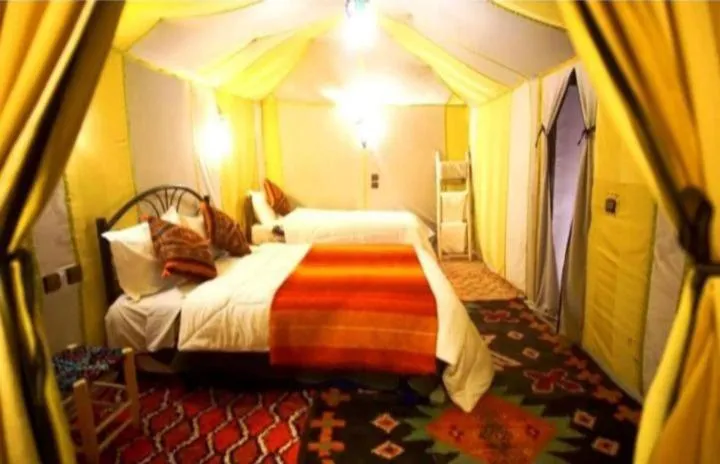 Bed in Merzouga Luxury Camp