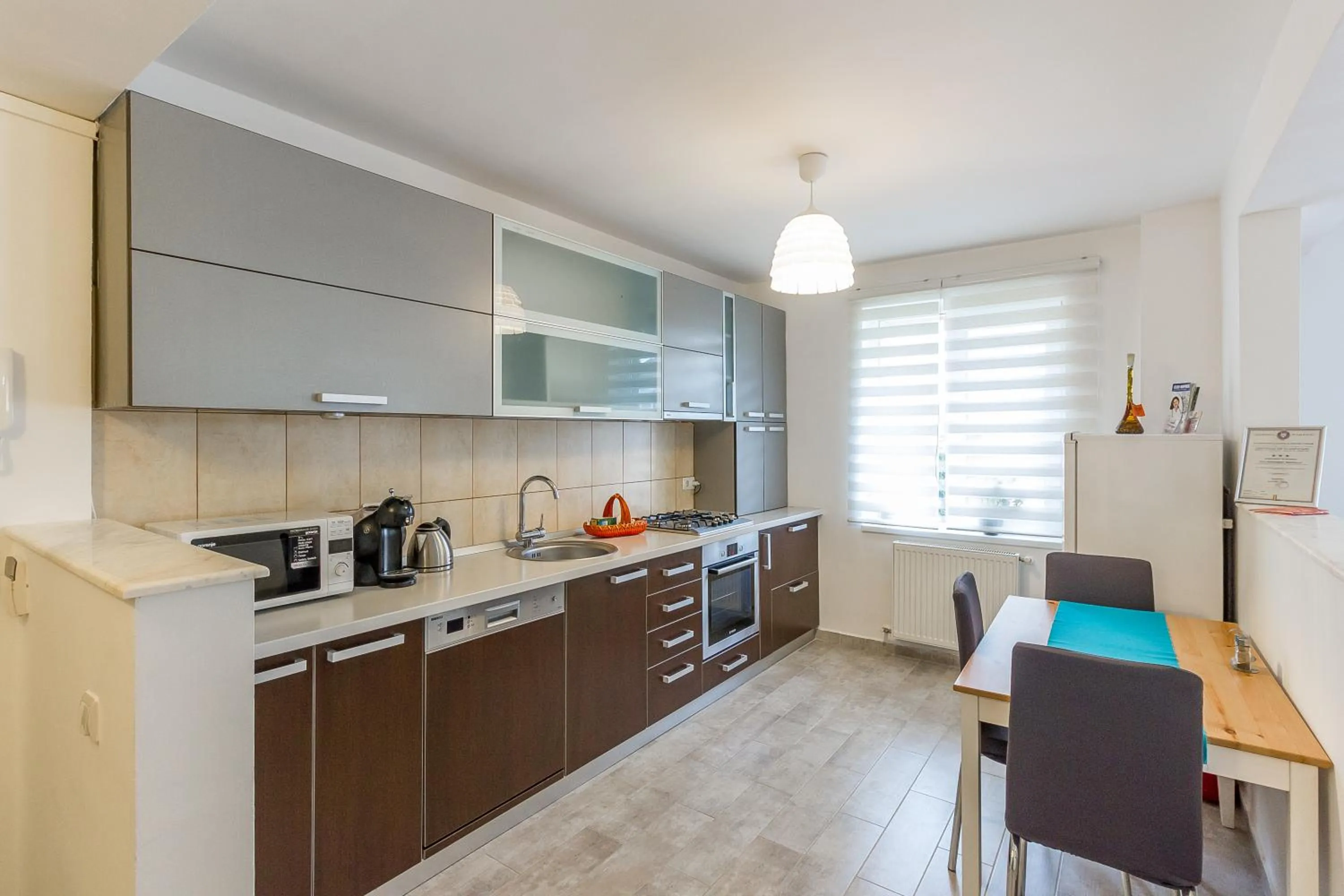 Kitchen or kitchenette in City Apartment Trifoiului