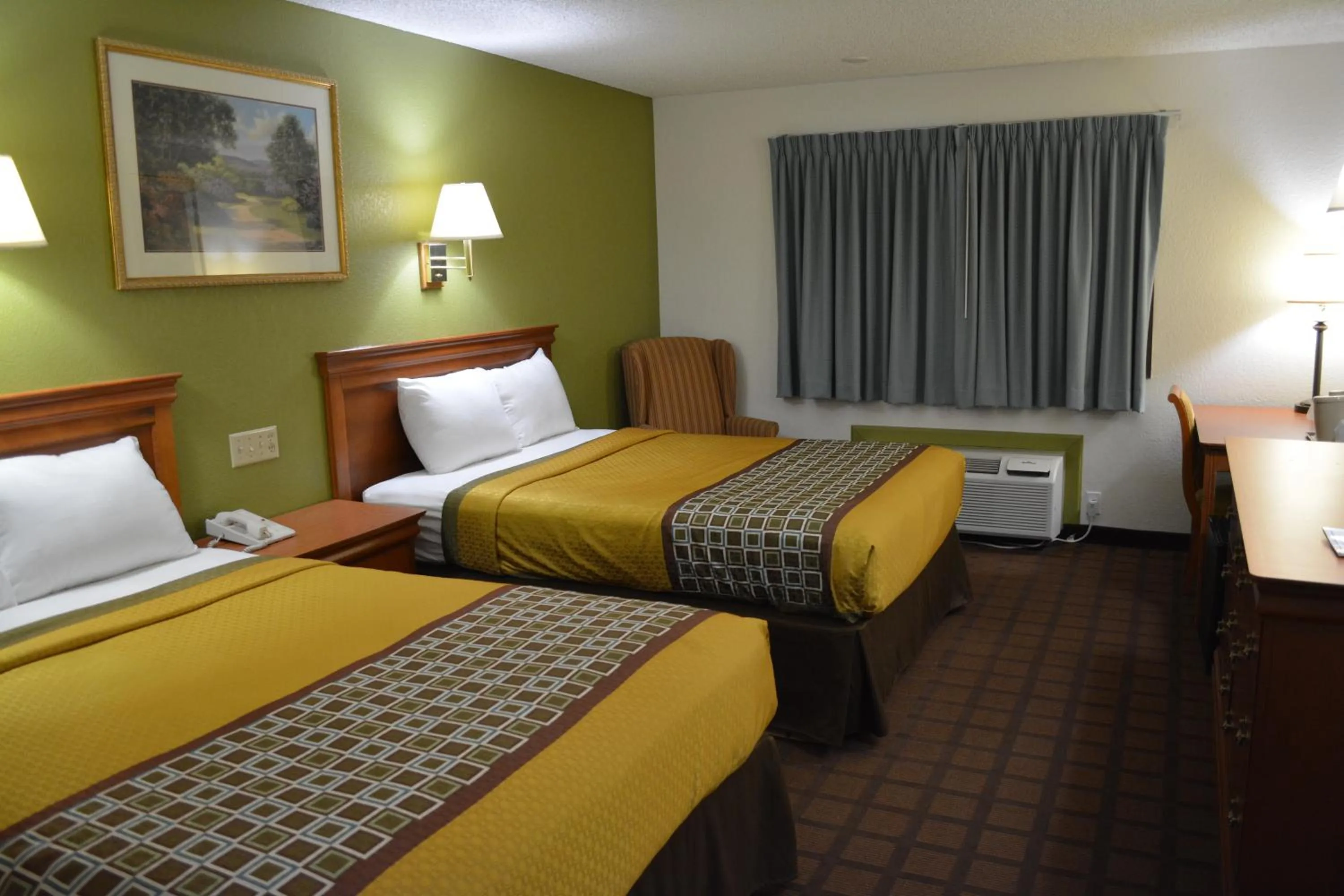 Bed in Bloomer Inn & Suites
