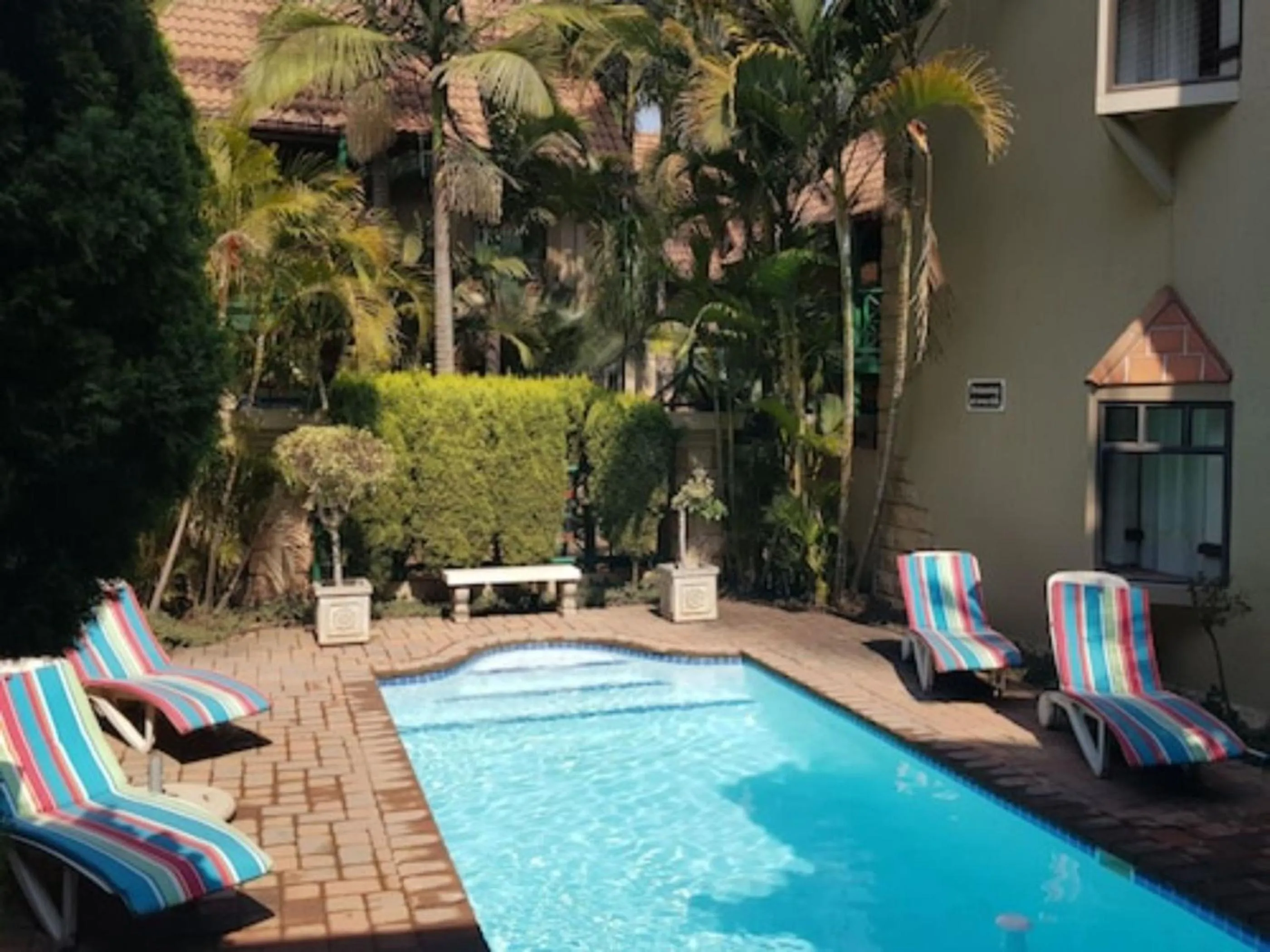 Property building in Court Classique Suite Hotel