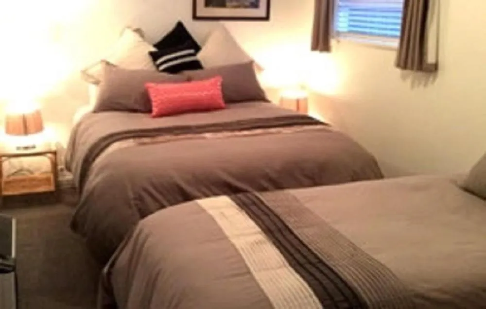 Bed in Noah's Boutique Accommodation Moeraki