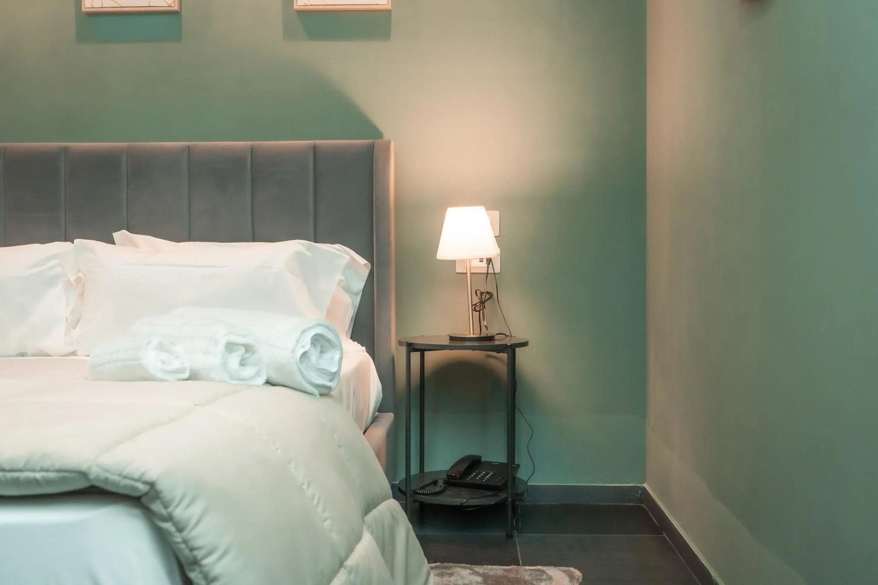 Bed in Noah Gate Hotel & Suites