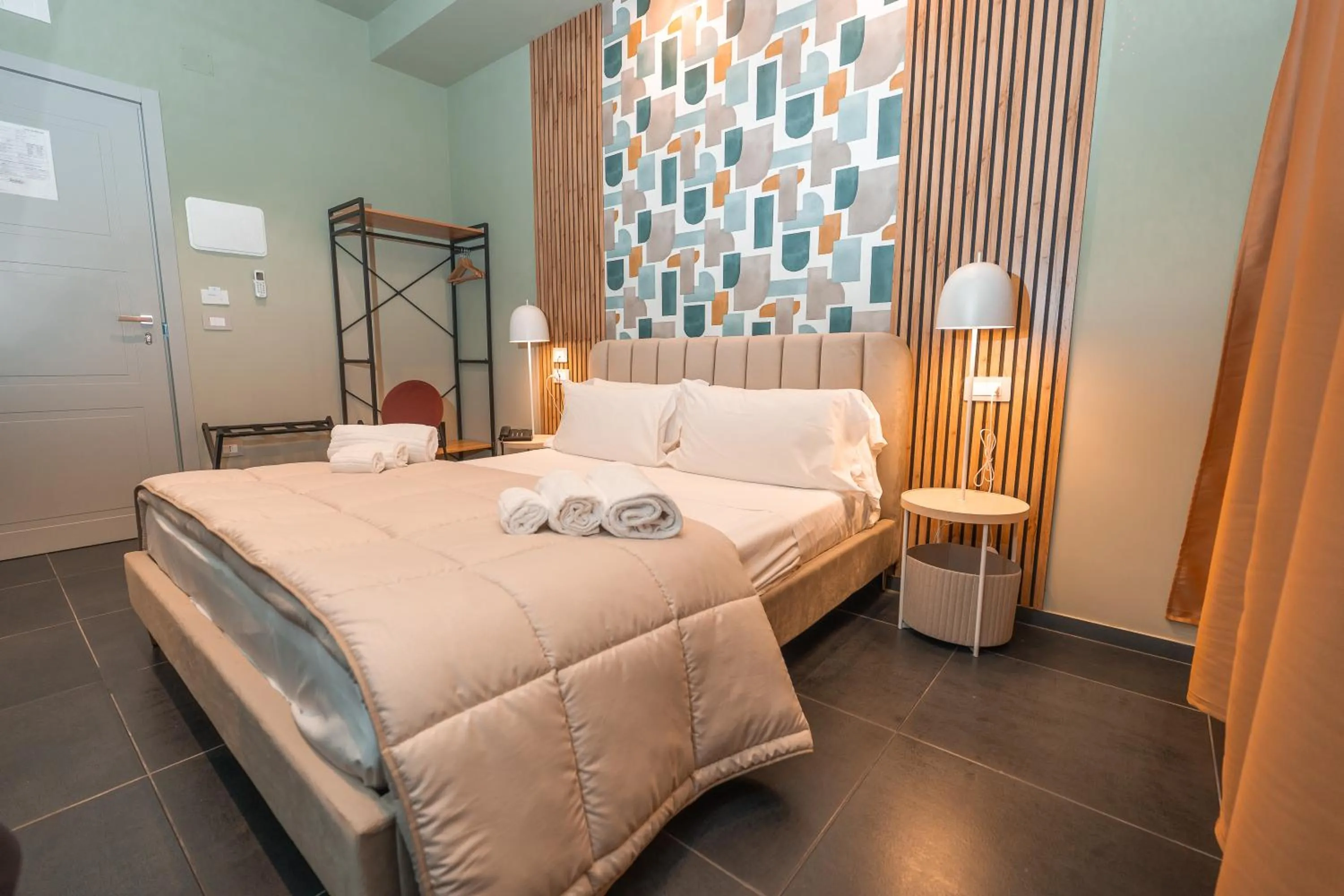 Bed in Noah Gate Hotel & Suites