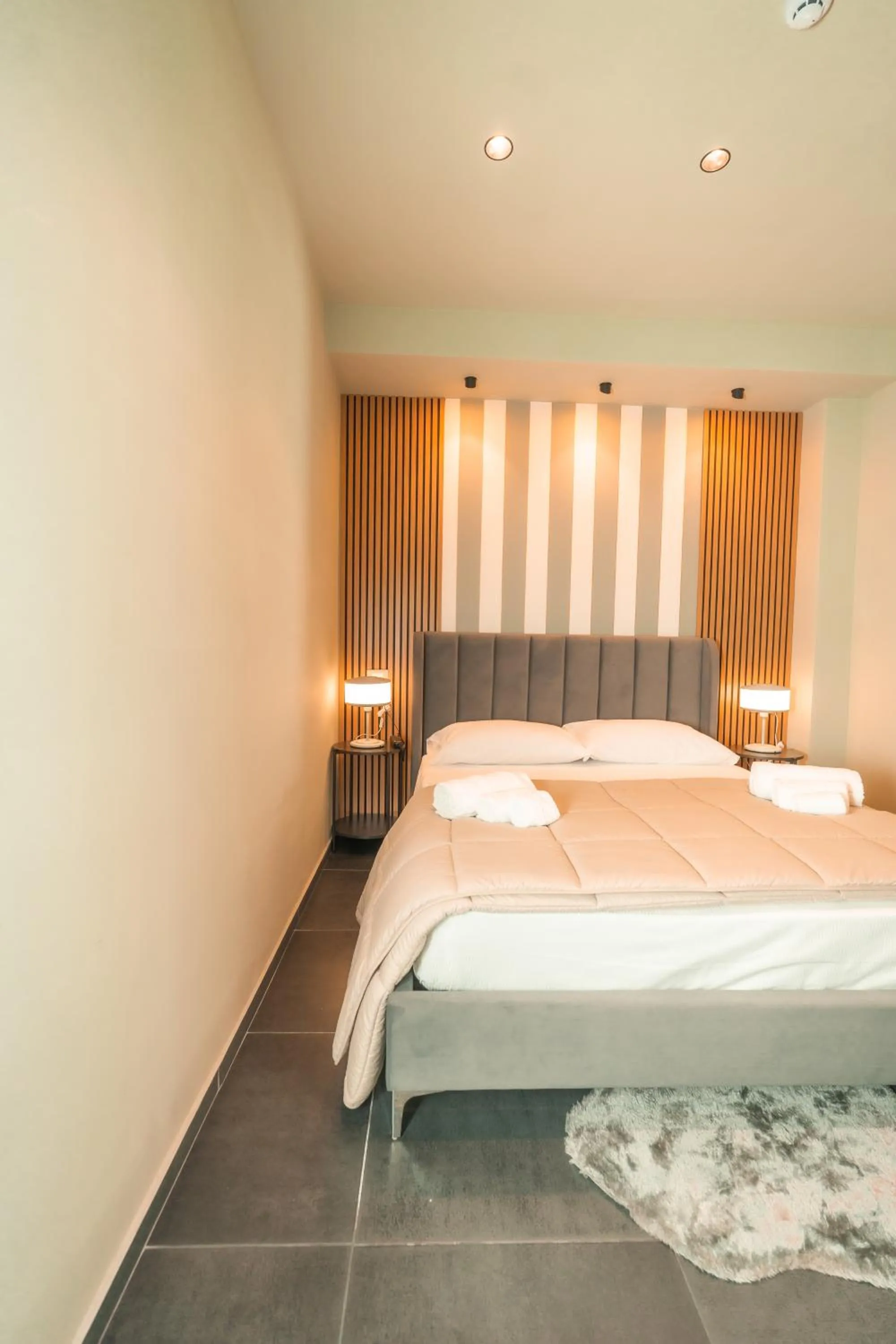 Bed in Noah Gate Hotel & Suites