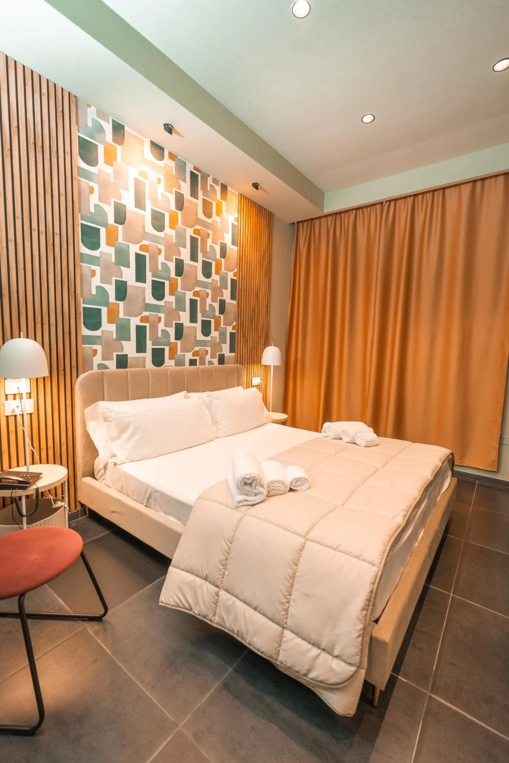 Bed in Noah Gate Hotel & Suites