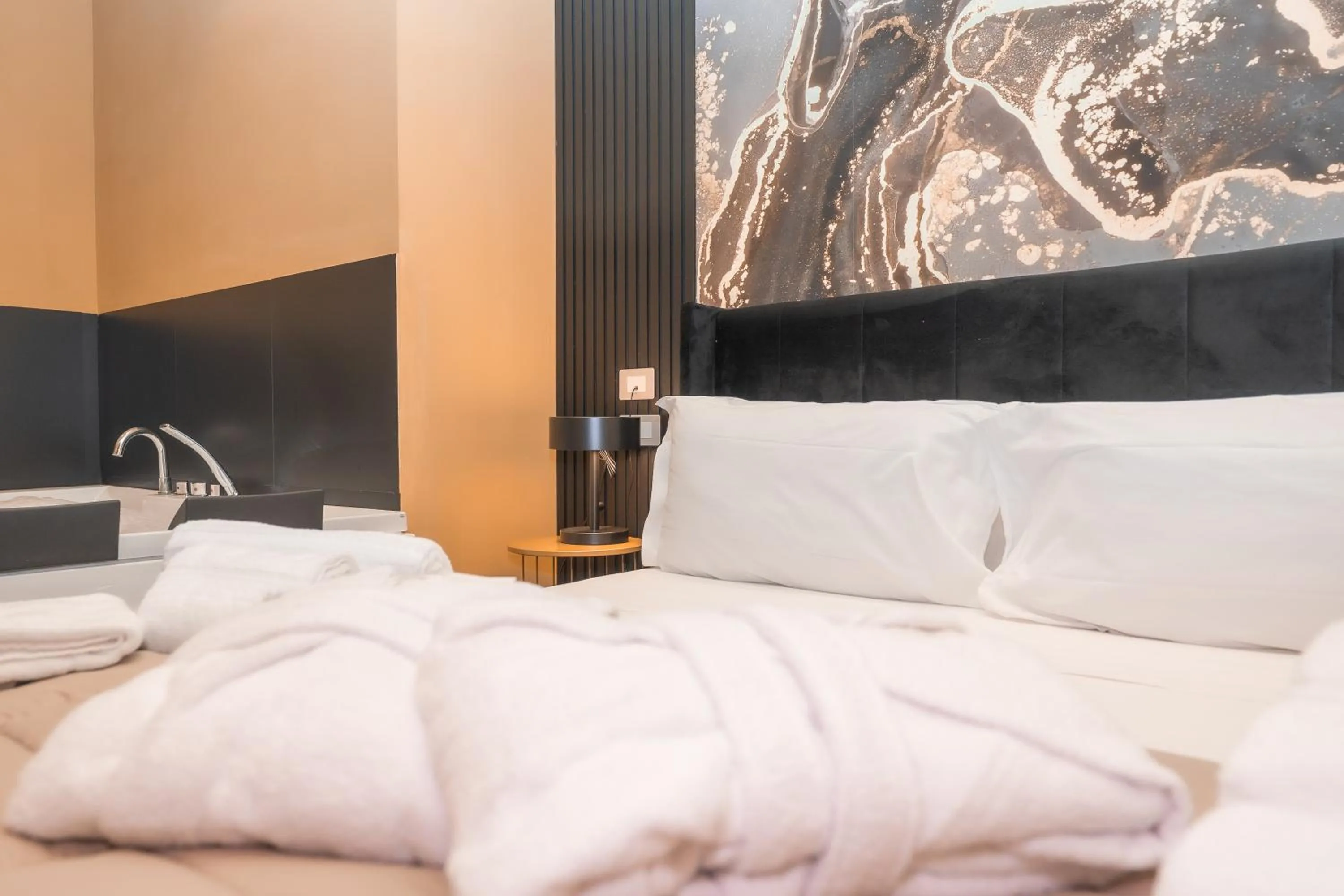 Bed in Noah Gate Hotel & Suites