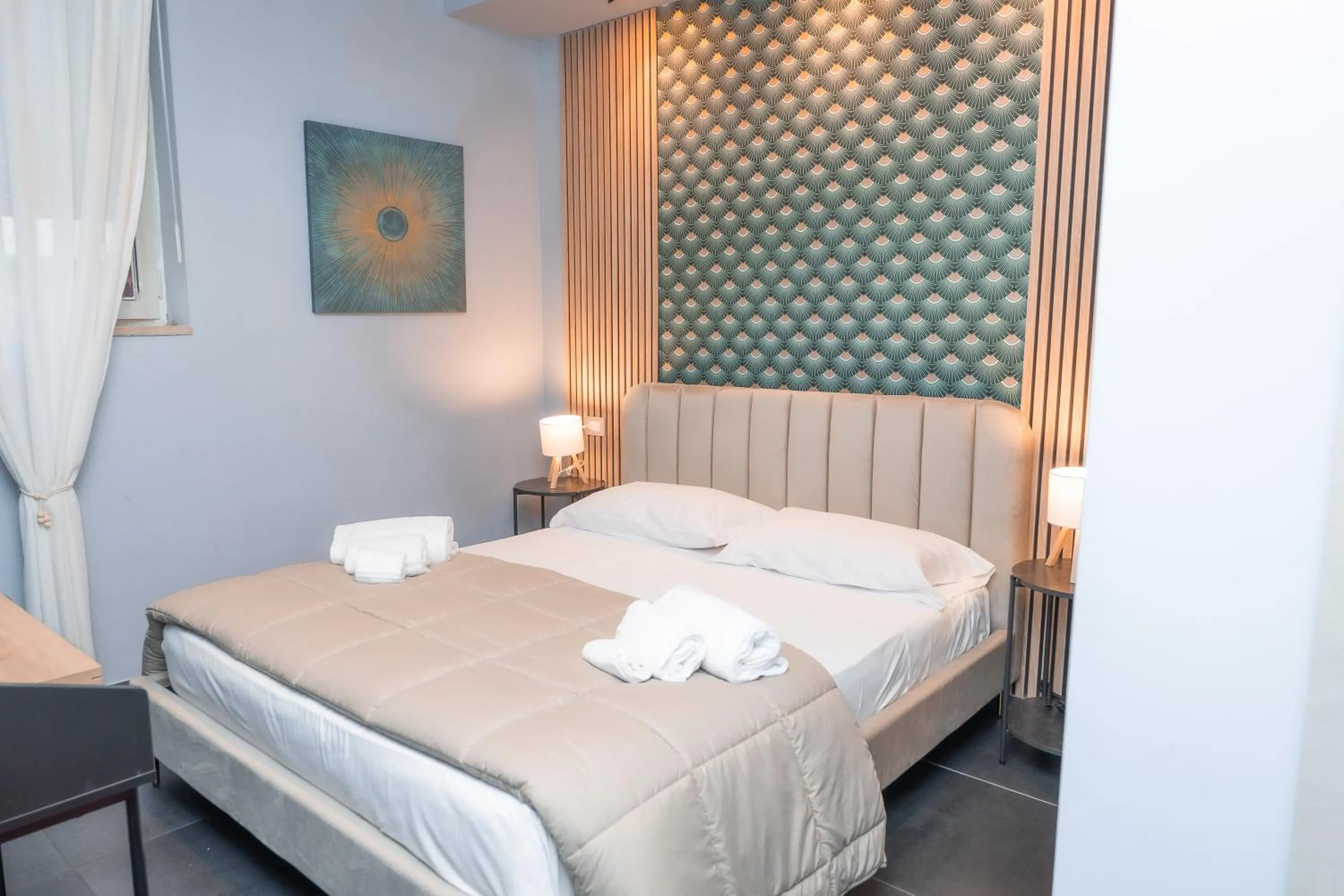 Bed in Noah Gate Hotel & Suites
