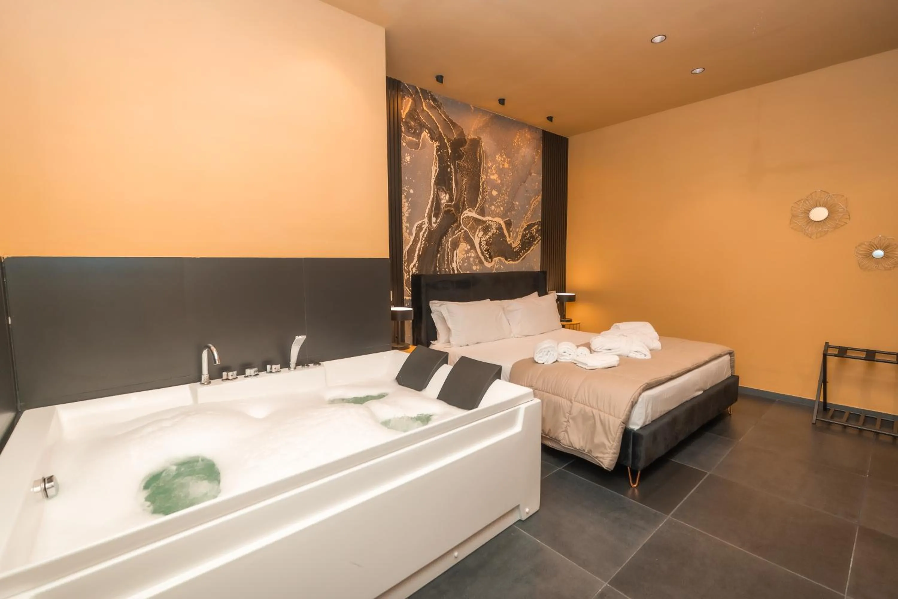 Bed in Noah Gate Hotel & Suites