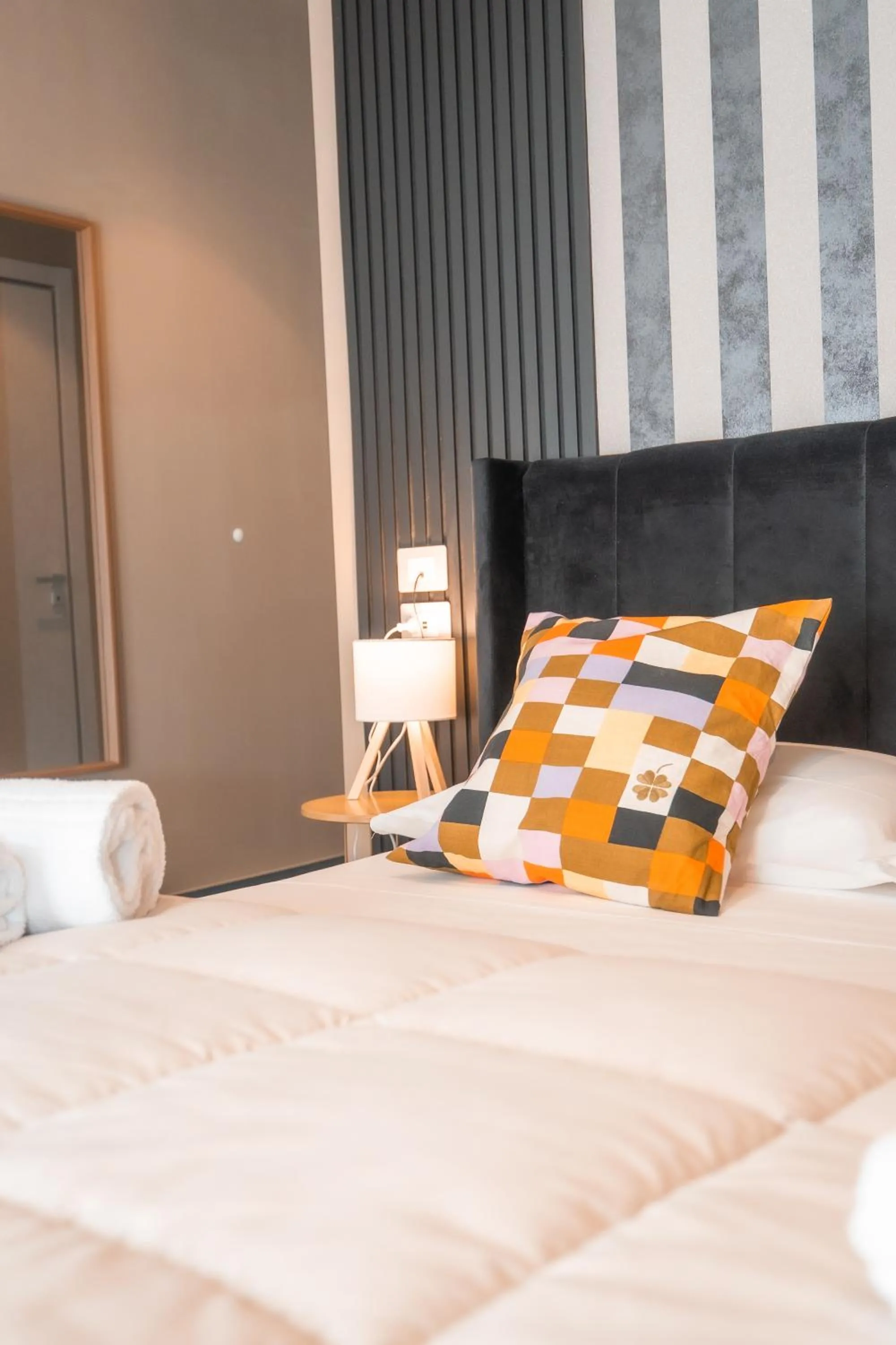 Bed in Noah Gate Hotel & Suites