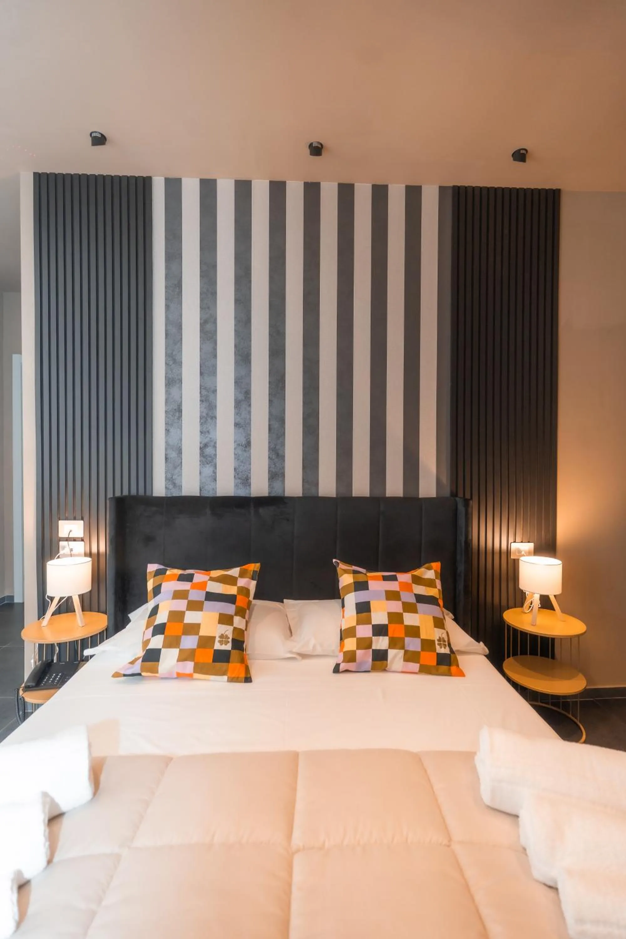 Bed in Noah Gate Hotel & Suites