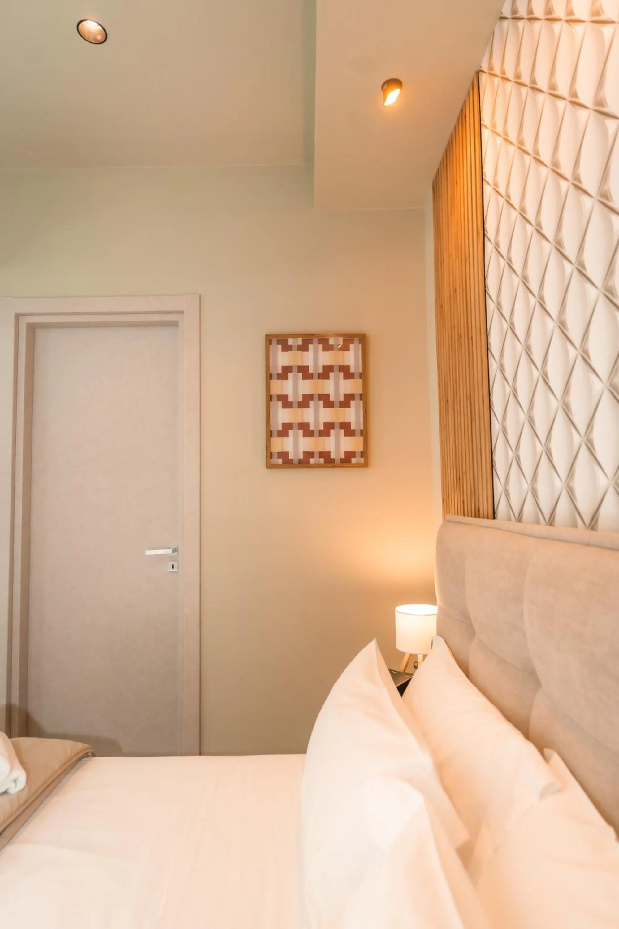 Bed in Noah Gate Hotel & Suites