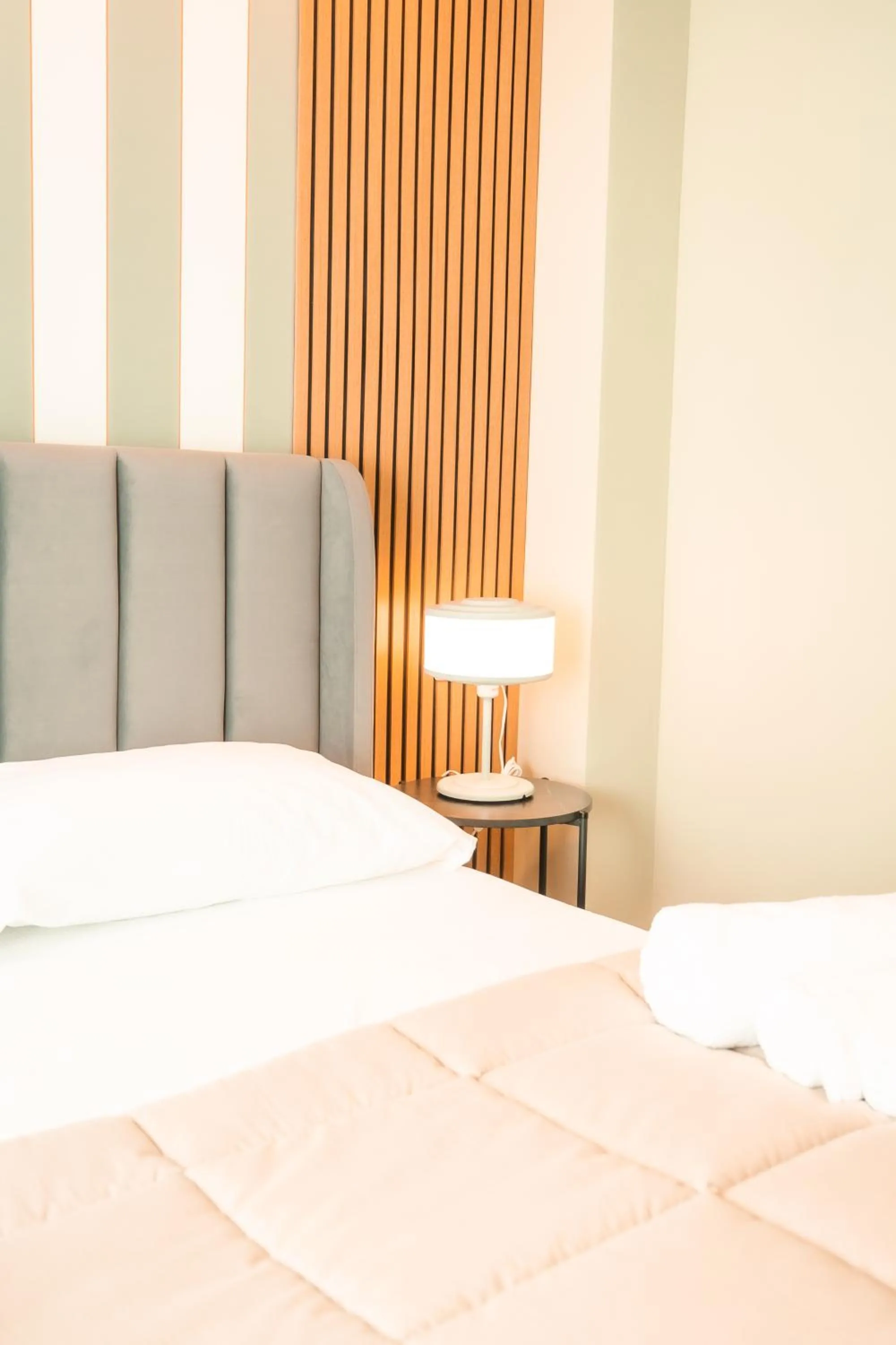 Bed in Noah Gate Hotel & Suites