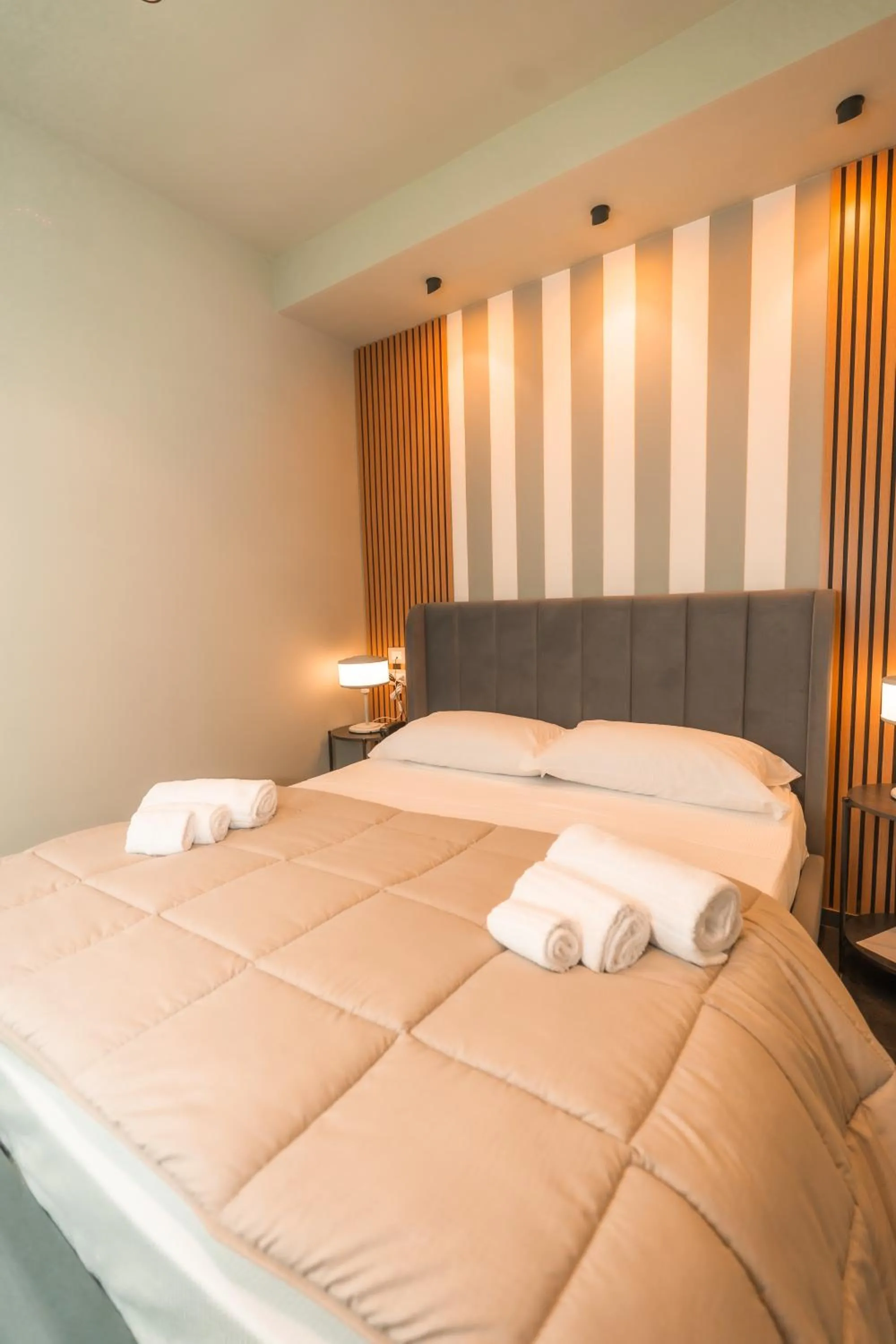 Bed in Noah Gate Hotel & Suites