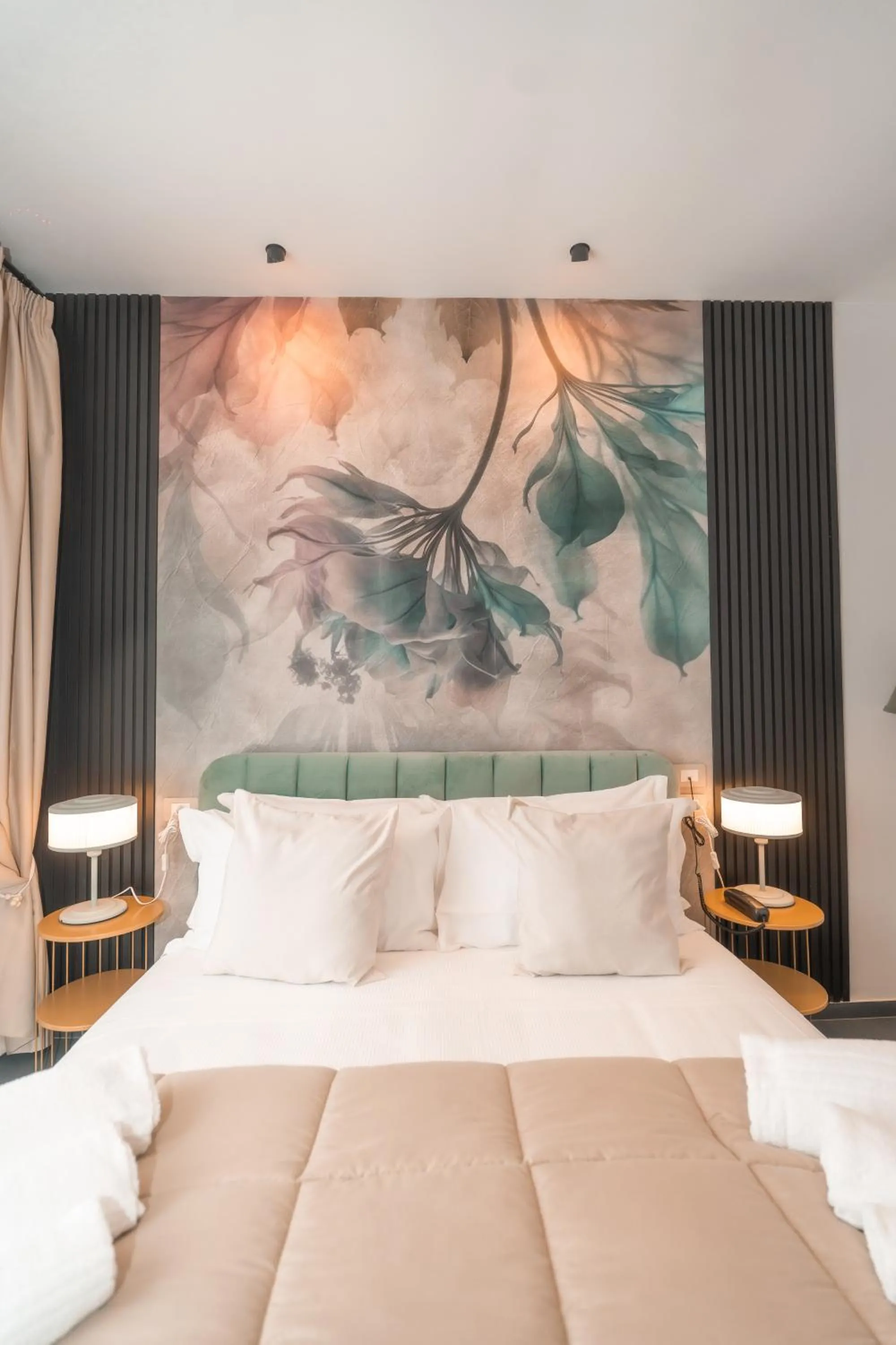 Bed in Noah Gate Hotel & Suites