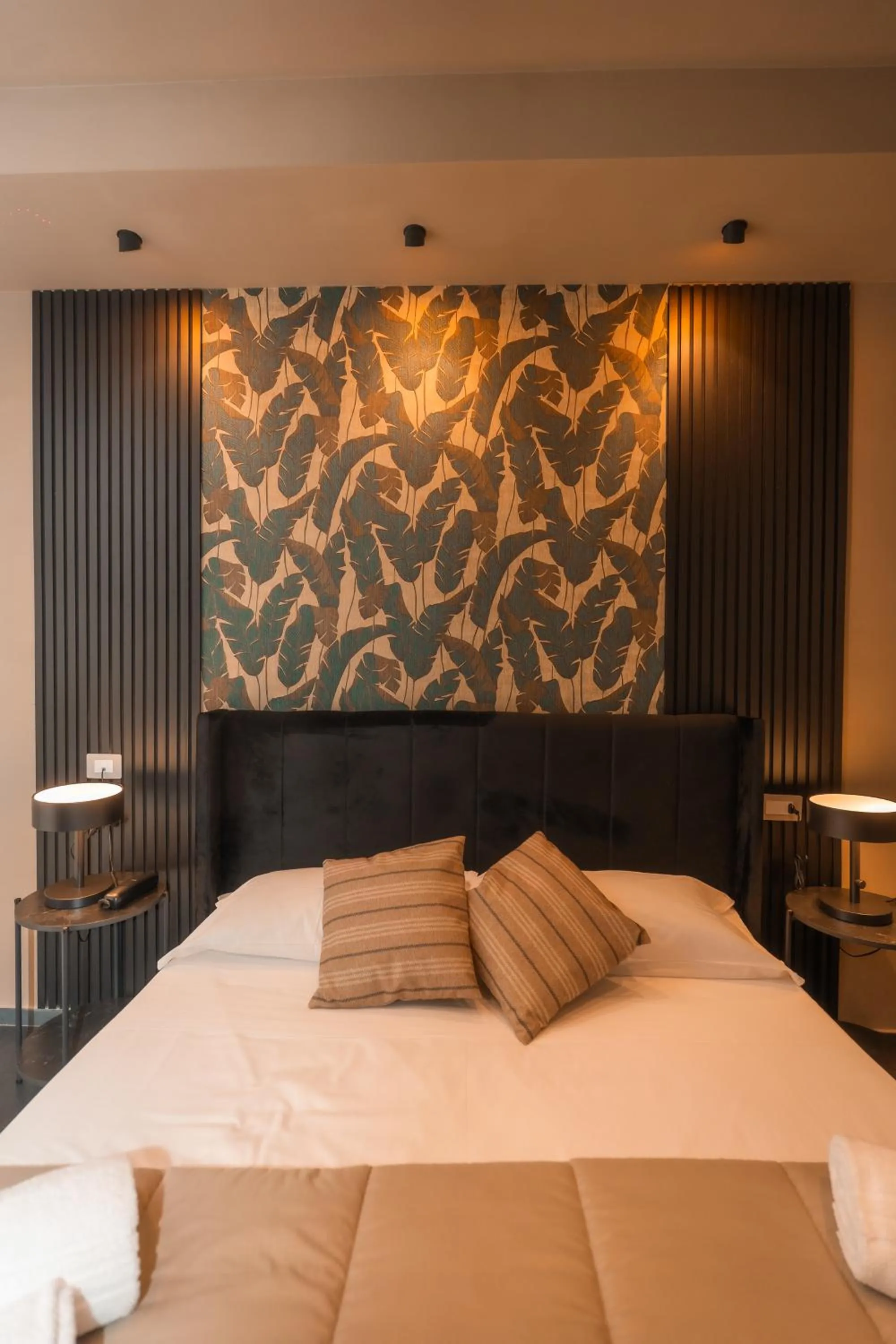 Bed in Noah Gate Hotel & Suites