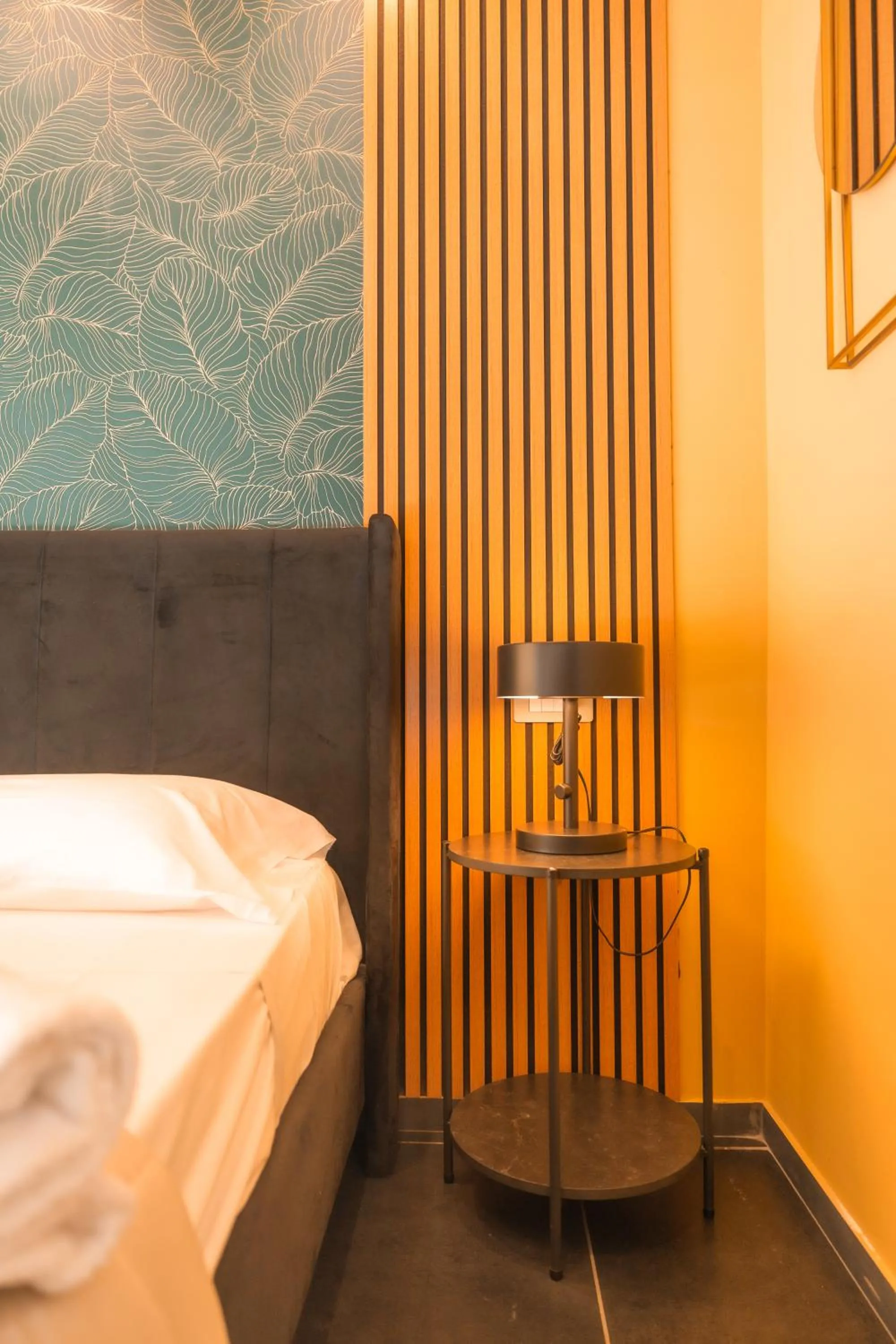 Bed in Noah Gate Hotel & Suites