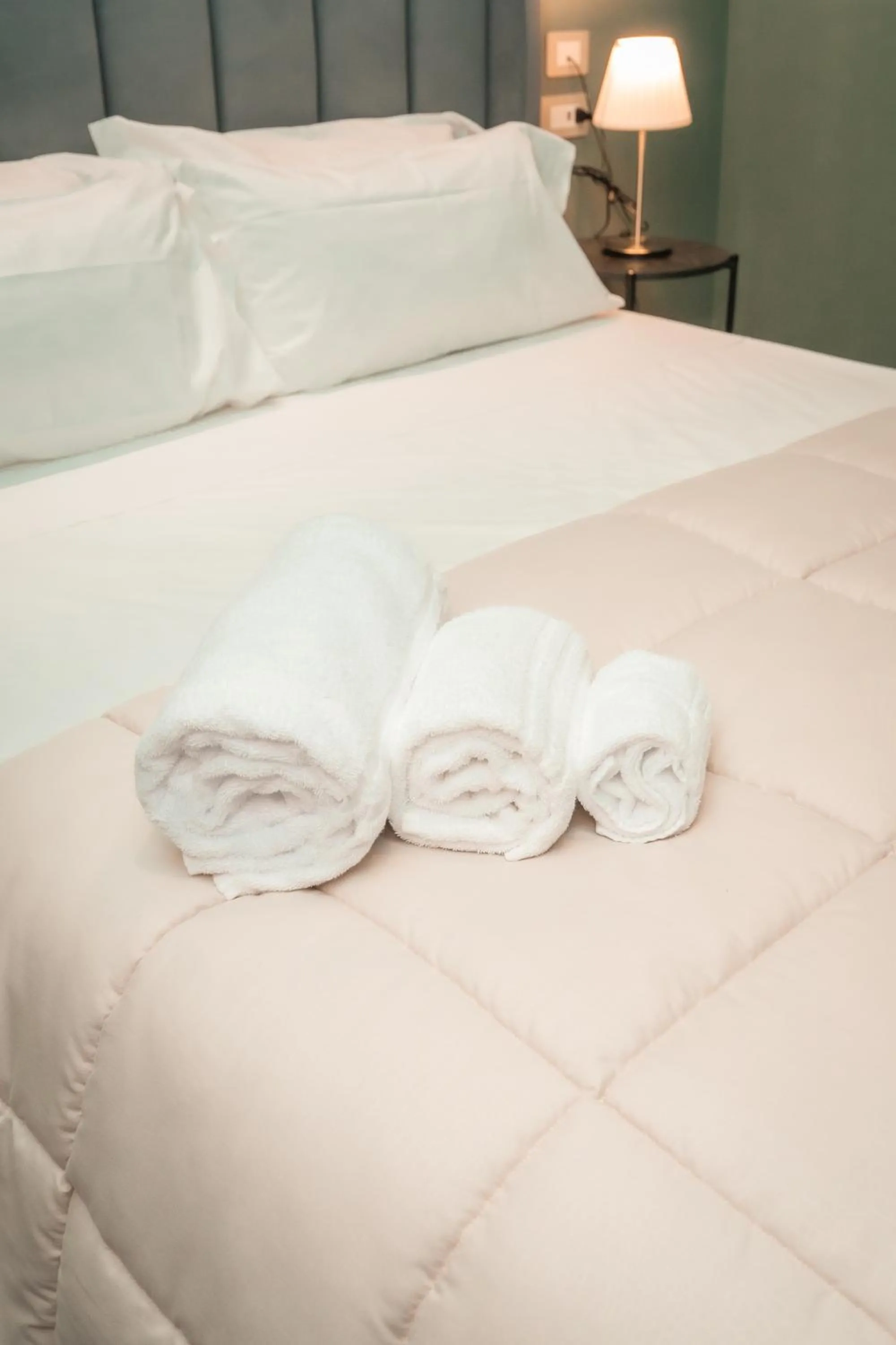 Bed in Noah Gate Hotel & Suites