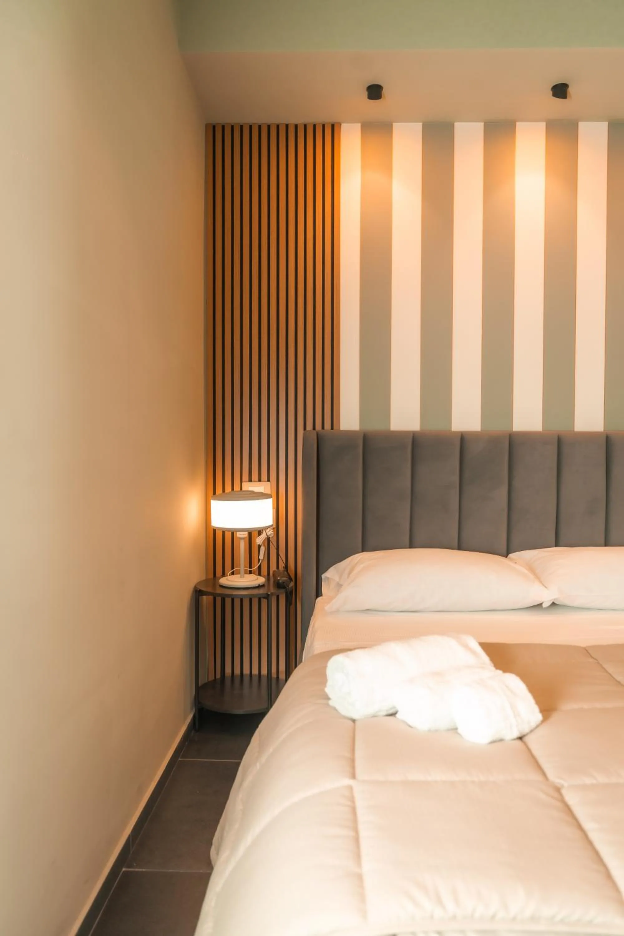 Bed in Noah Gate Hotel & Suites