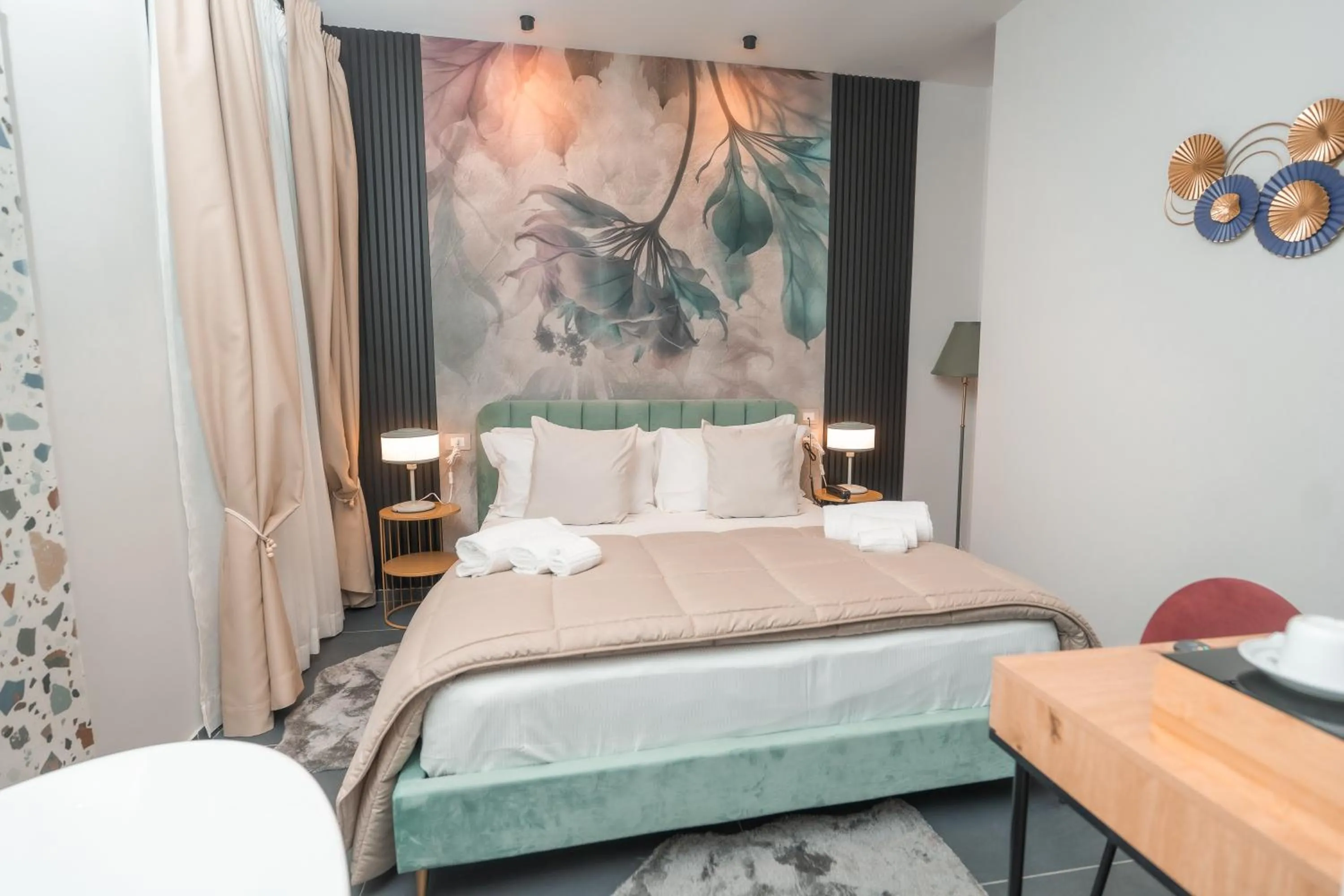Bed in Noah Gate Hotel & Suites
