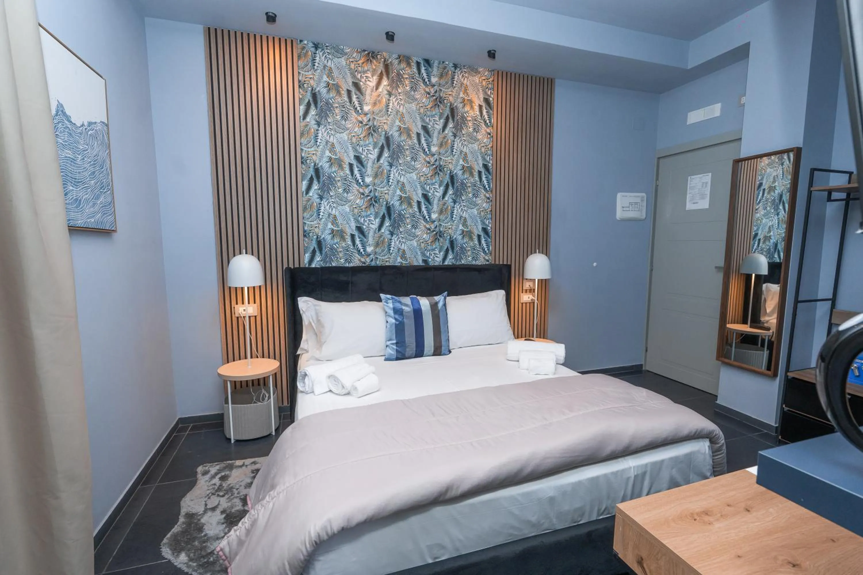 Bed in Noah Gate Hotel & Suites