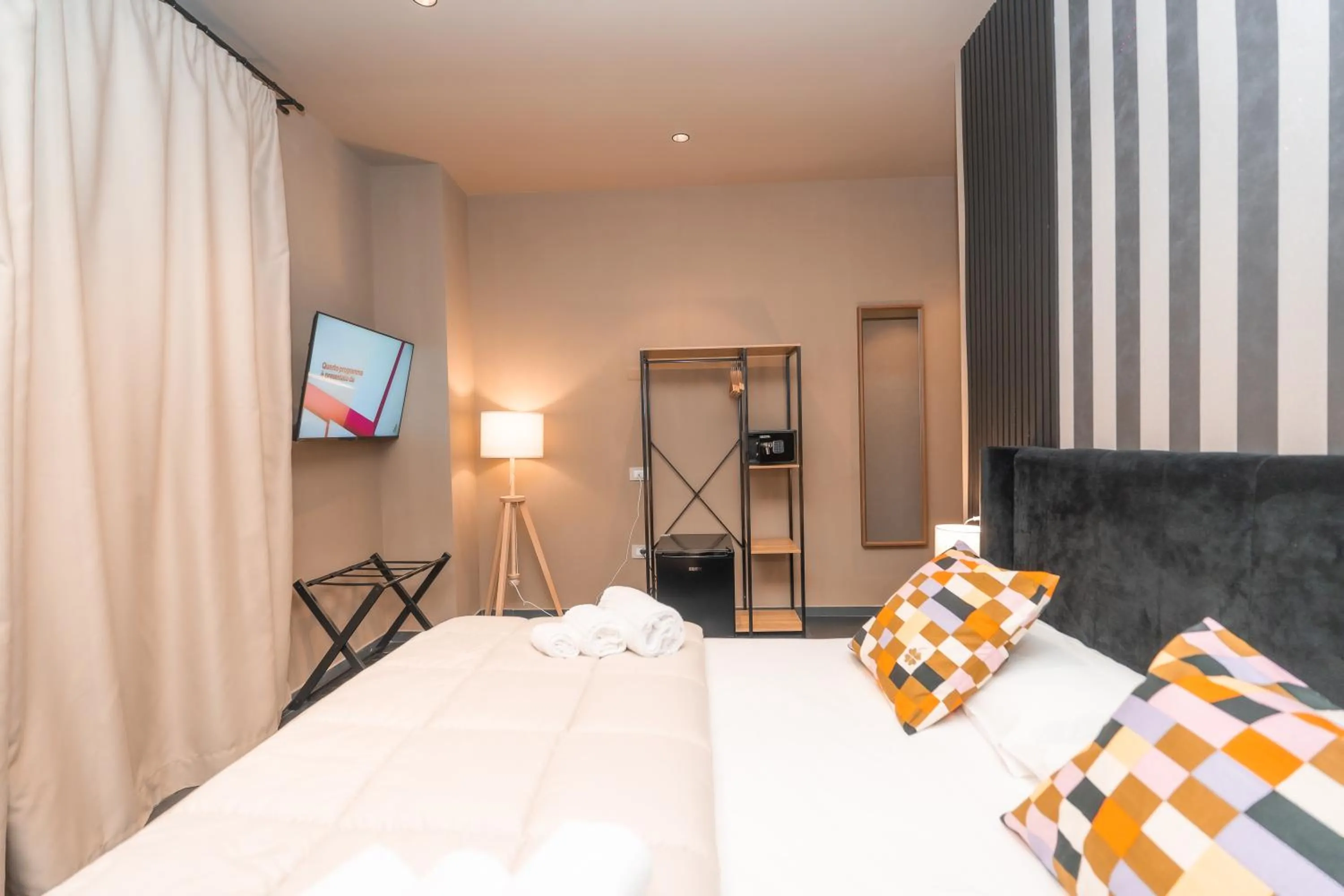 Bed in Noah Gate Hotel & Suites