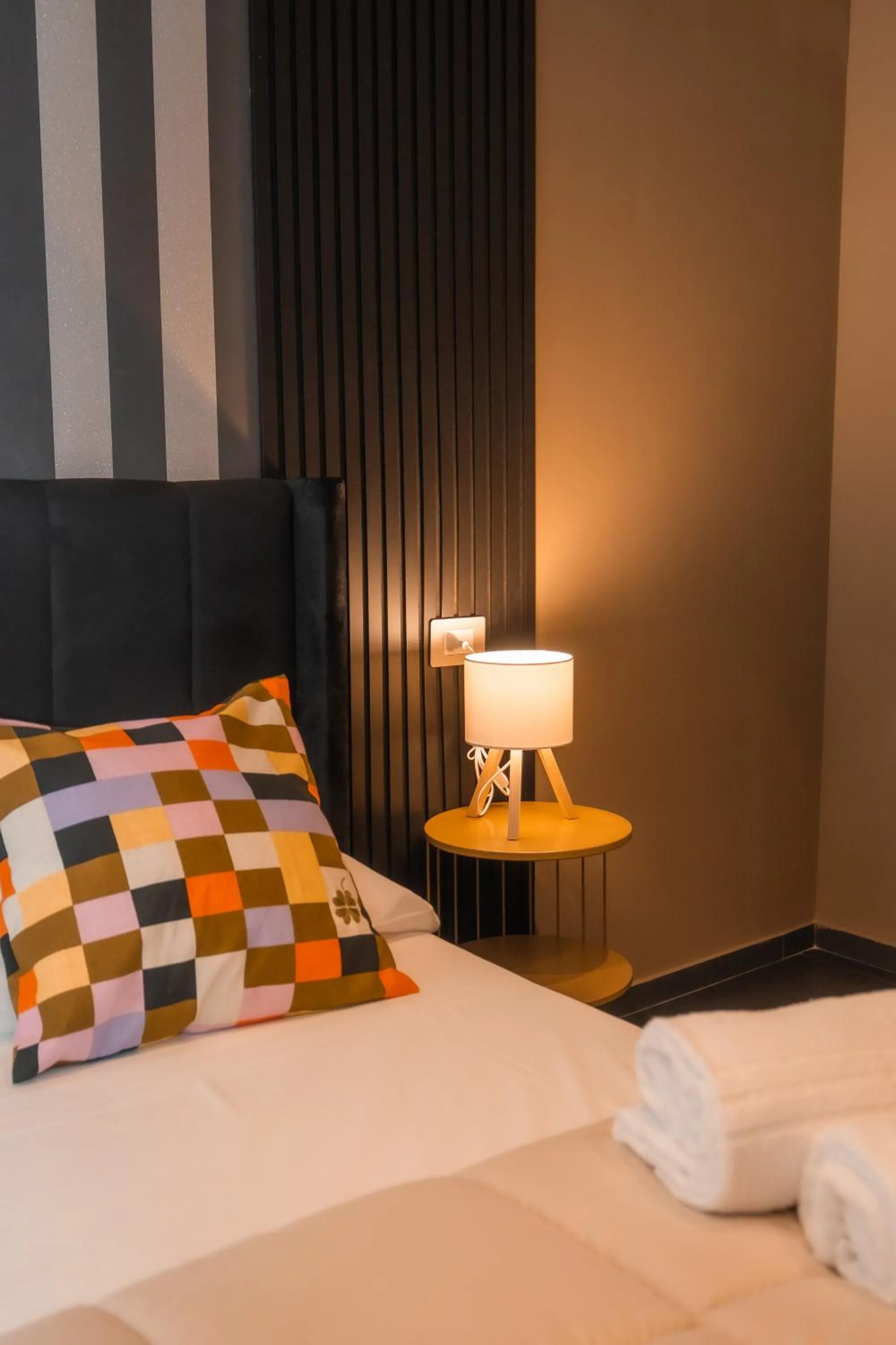Bed in Noah Gate Hotel & Suites
