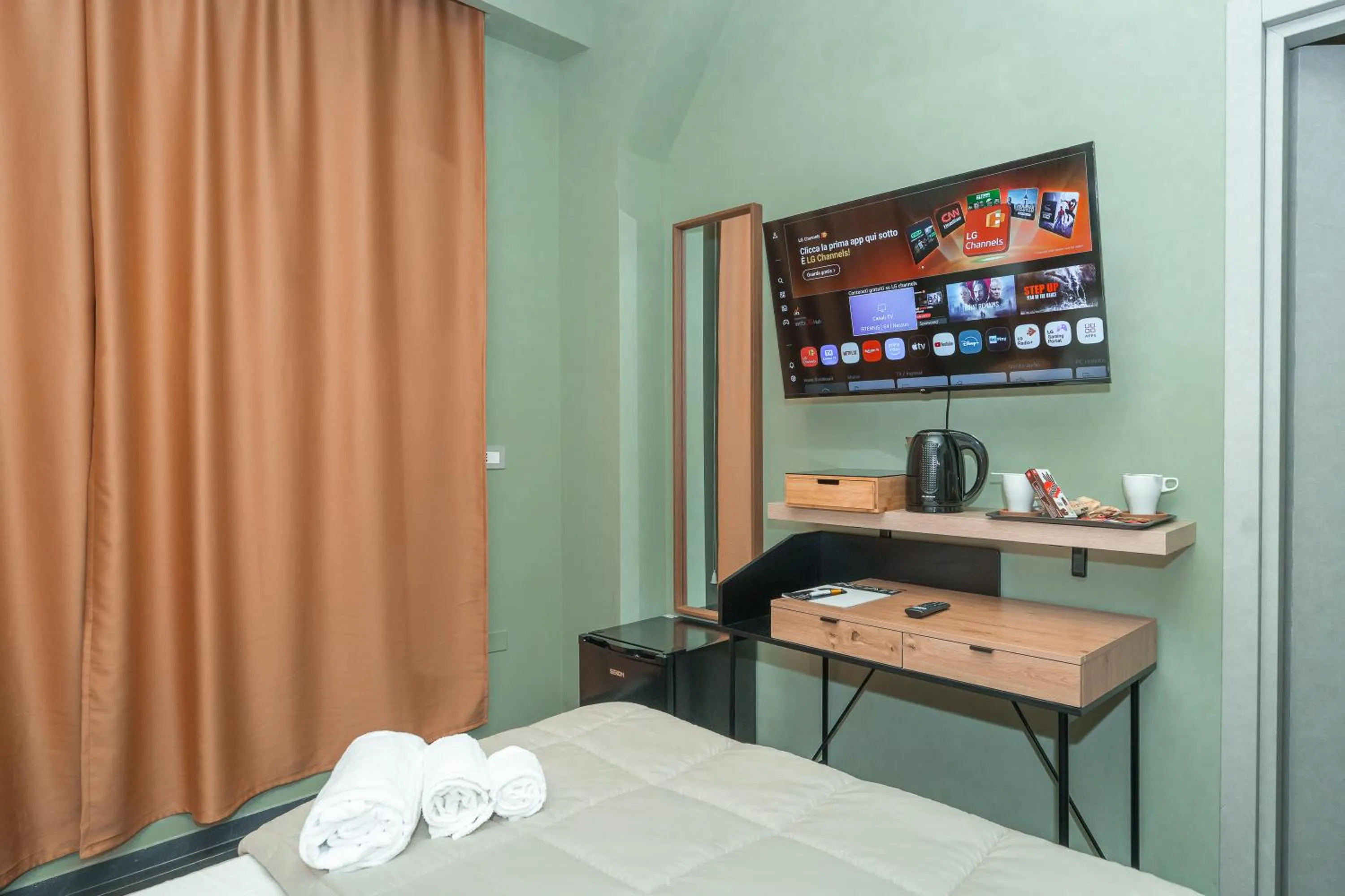 Bed in Noah Gate Hotel & Suites