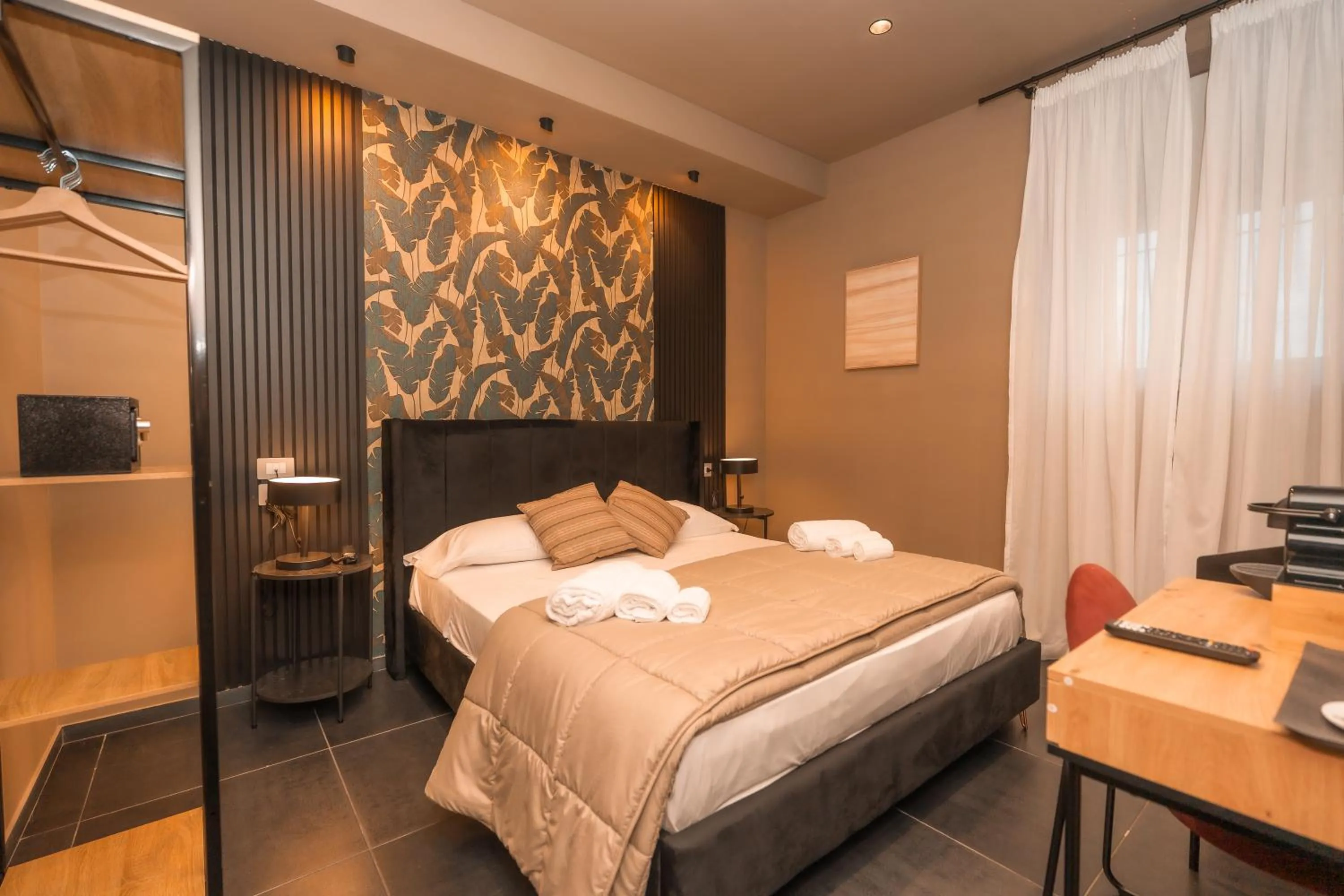 Bed in Noah Gate Hotel & Suites