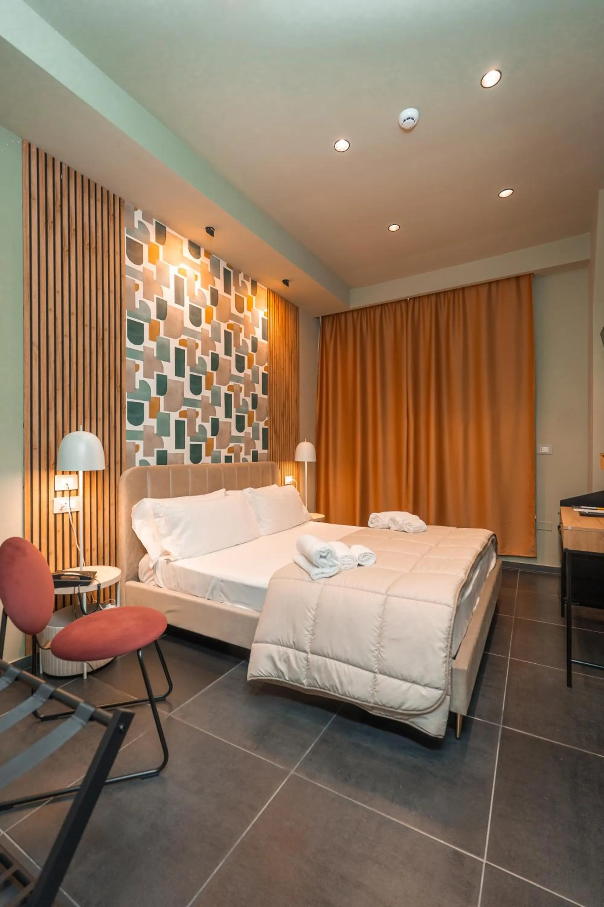 Bed in Noah Gate Hotel & Suites