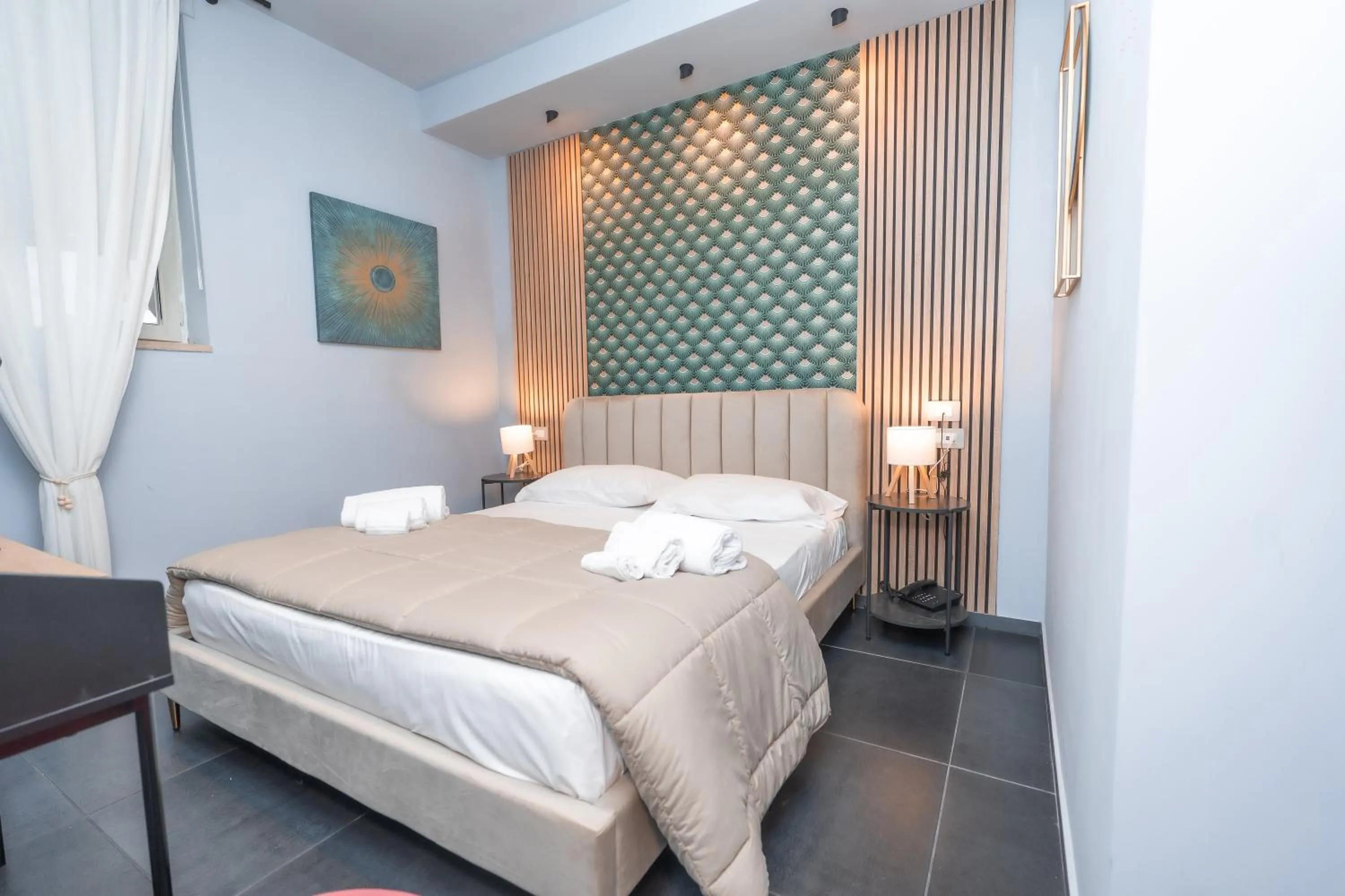 Bed in Noah Gate Hotel & Suites