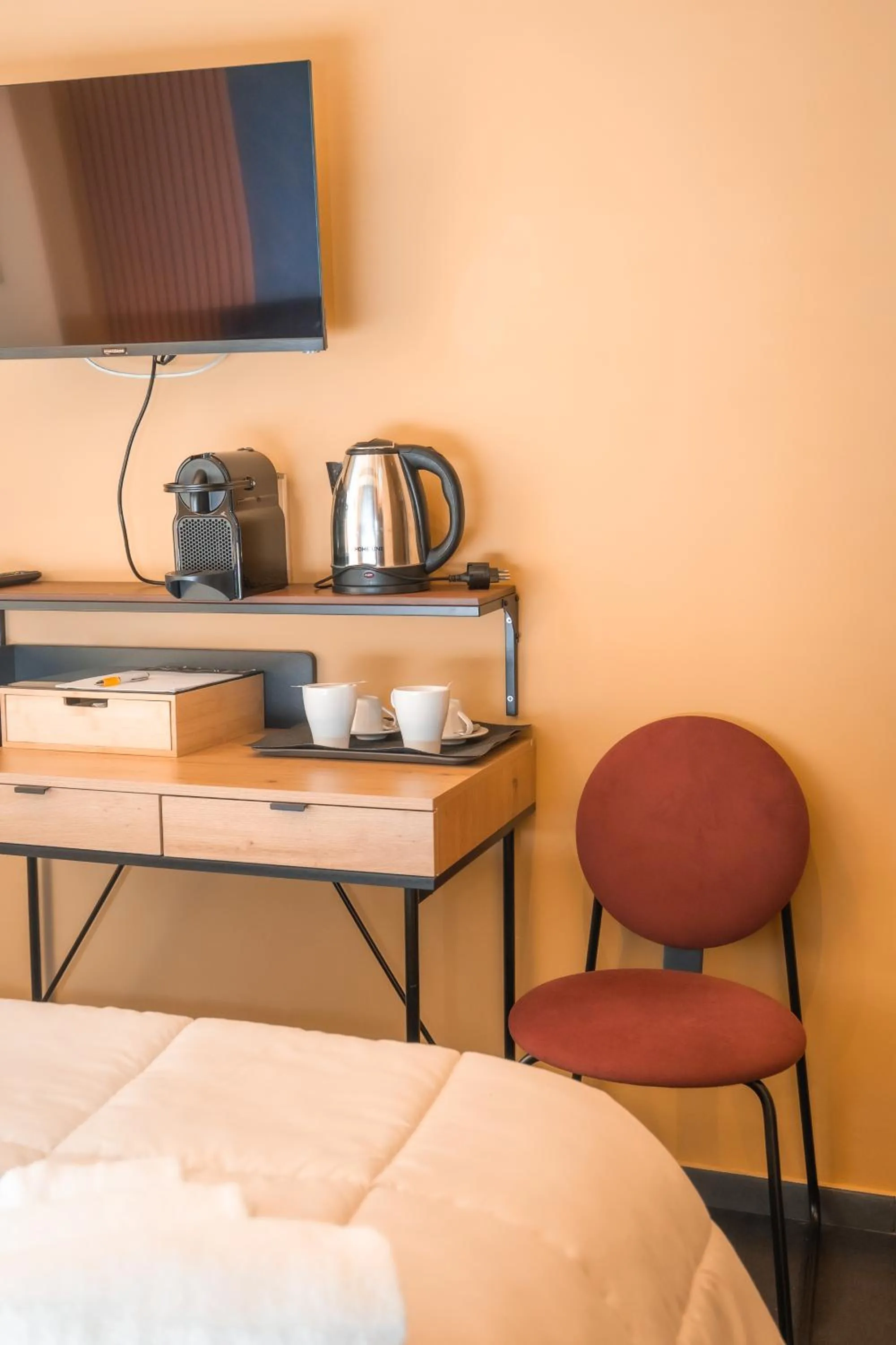 Bed in Noah Gate Hotel & Suites