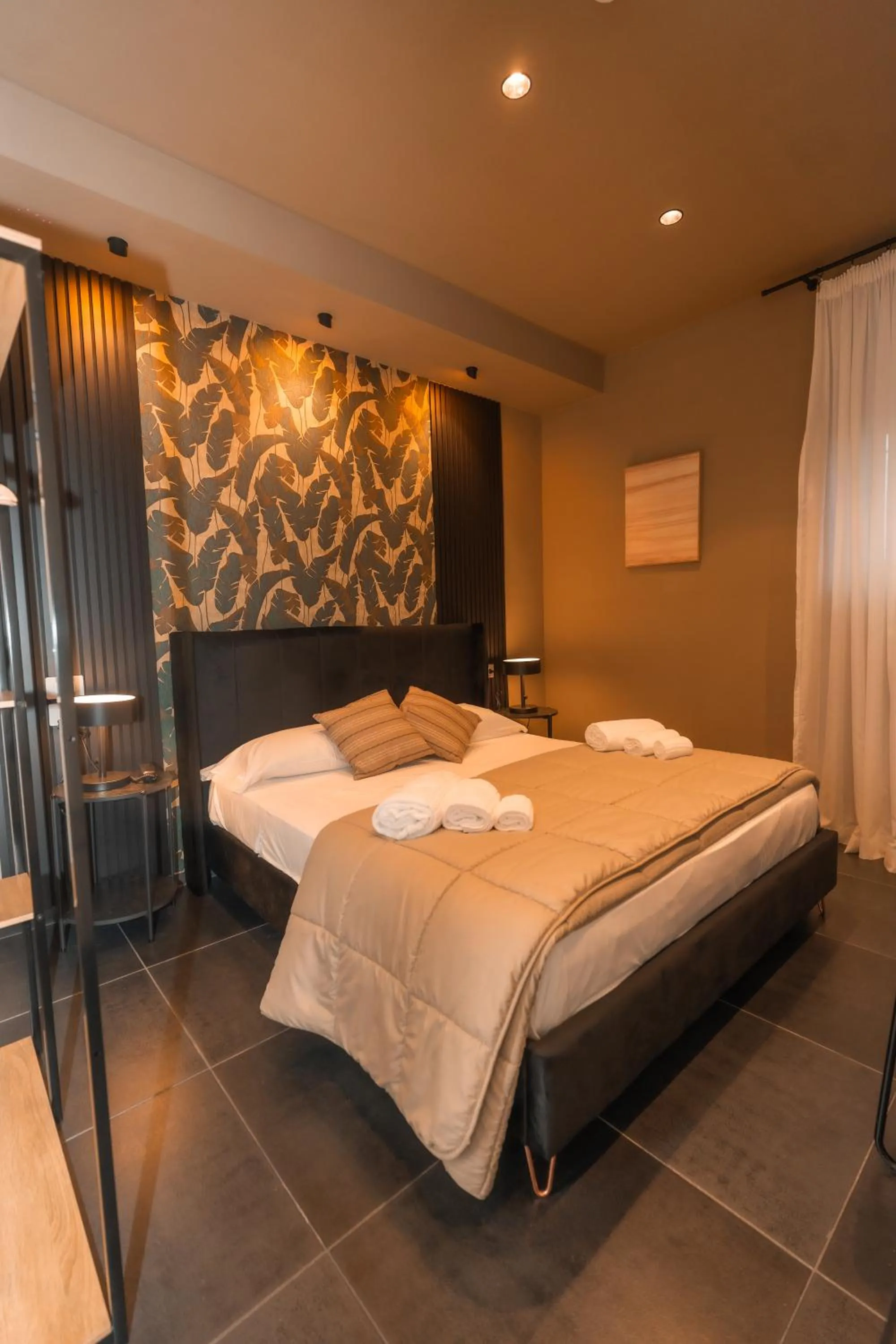 Bed in Noah Gate Hotel & Suites